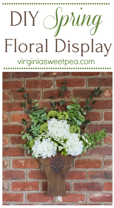 DIY Spring Floral Display - Learn how to make a floral display like this to display in your home. This would look great hanging on a door or on a porch wall. #springdecor #springfloralarrangement #springwreath #springdecorating