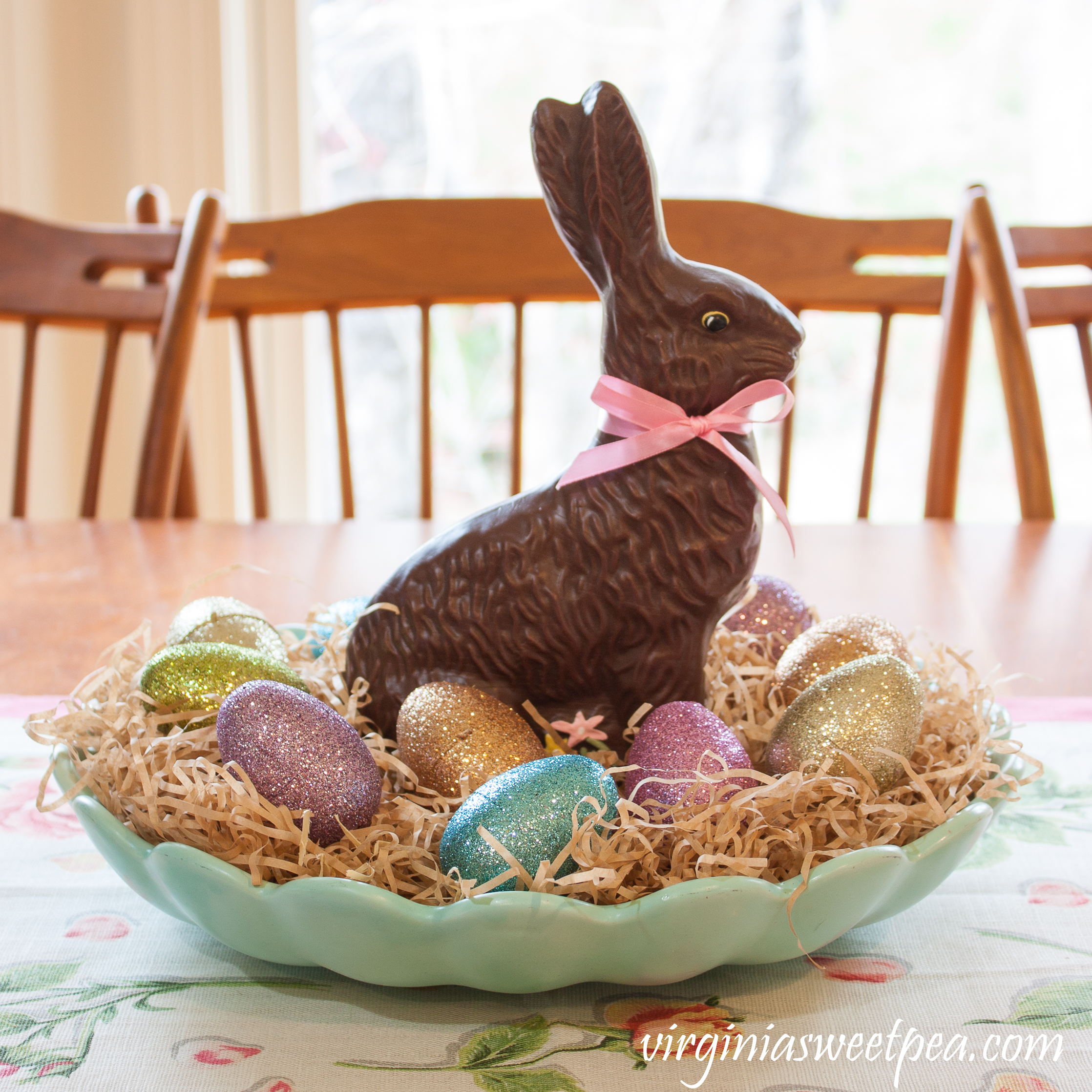 Easter Centerpiece - Faux chocolate rabbit in a vintage robin's egg blue bowl with paper shreds and glittered eggs