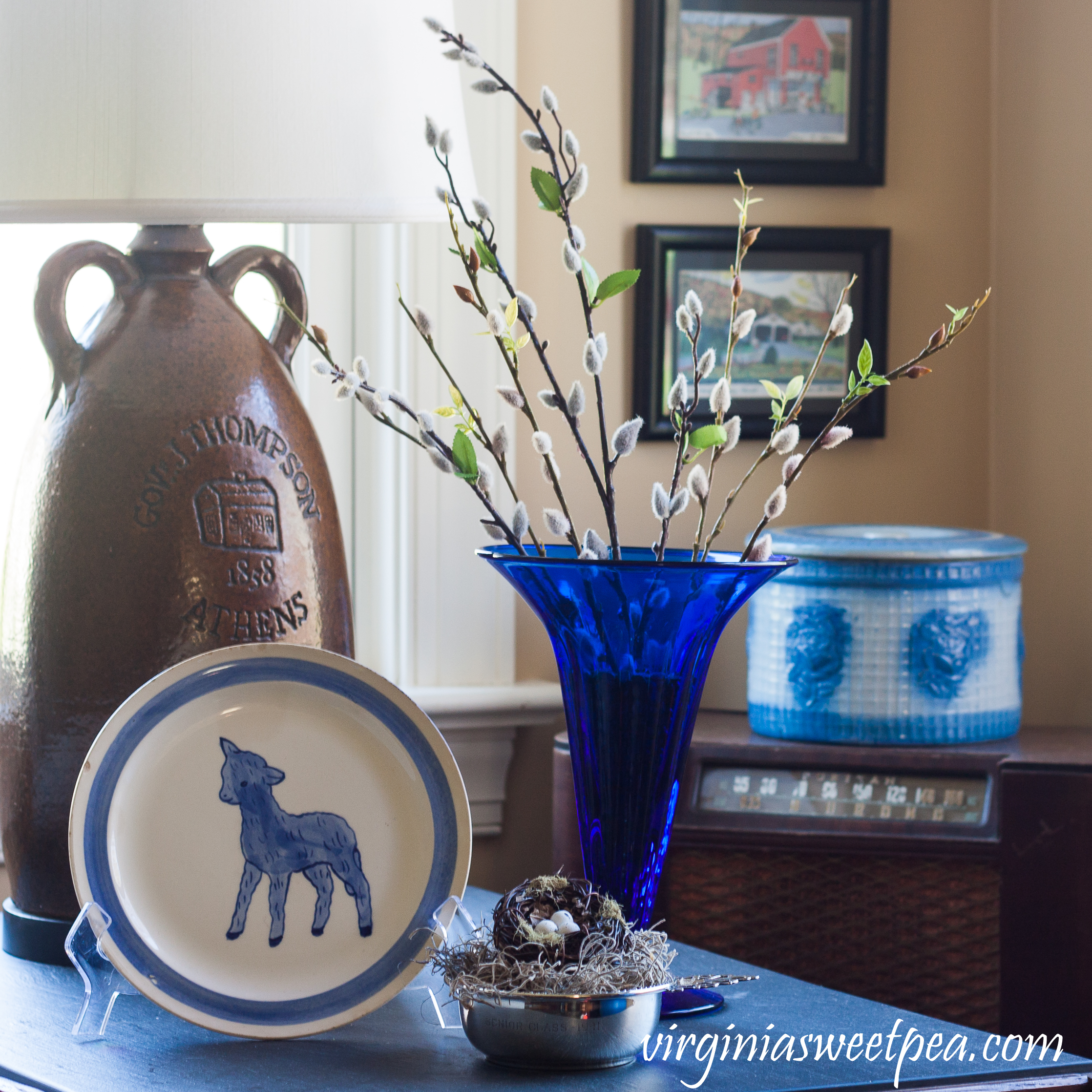 Decorating for Easter with Vintage - Easter vignette with a vintage Blue Ridge Pottery lamb plate, vintage blue Blenko vase, and a 1941 silver child's porridge bowl 