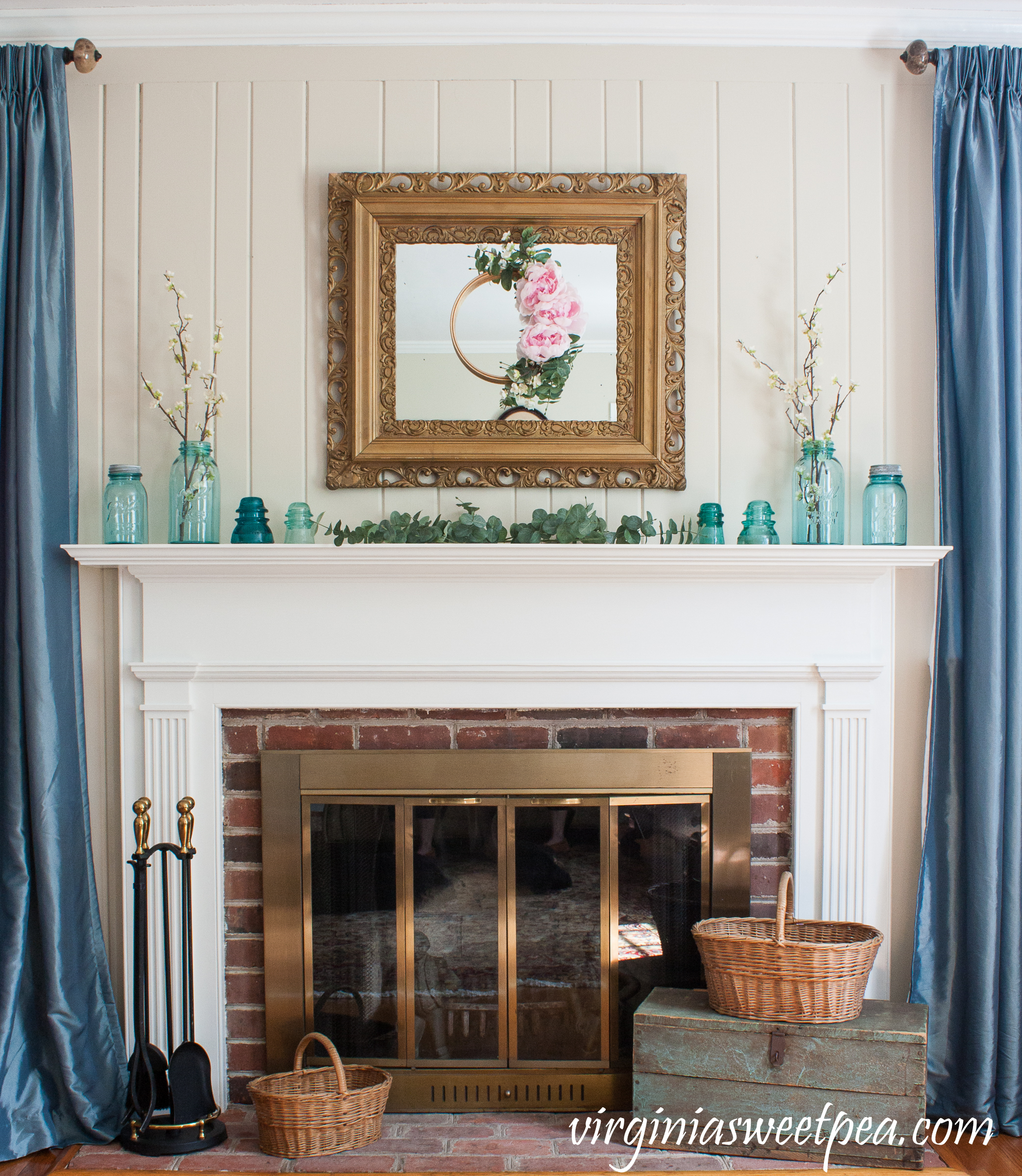 Spring Mantel with Vintage blue Ball Jars, Insulators, and Baskets - #springmantel #springdecor #vintagedecor #vintage #antiquebaskets #vintageddecor