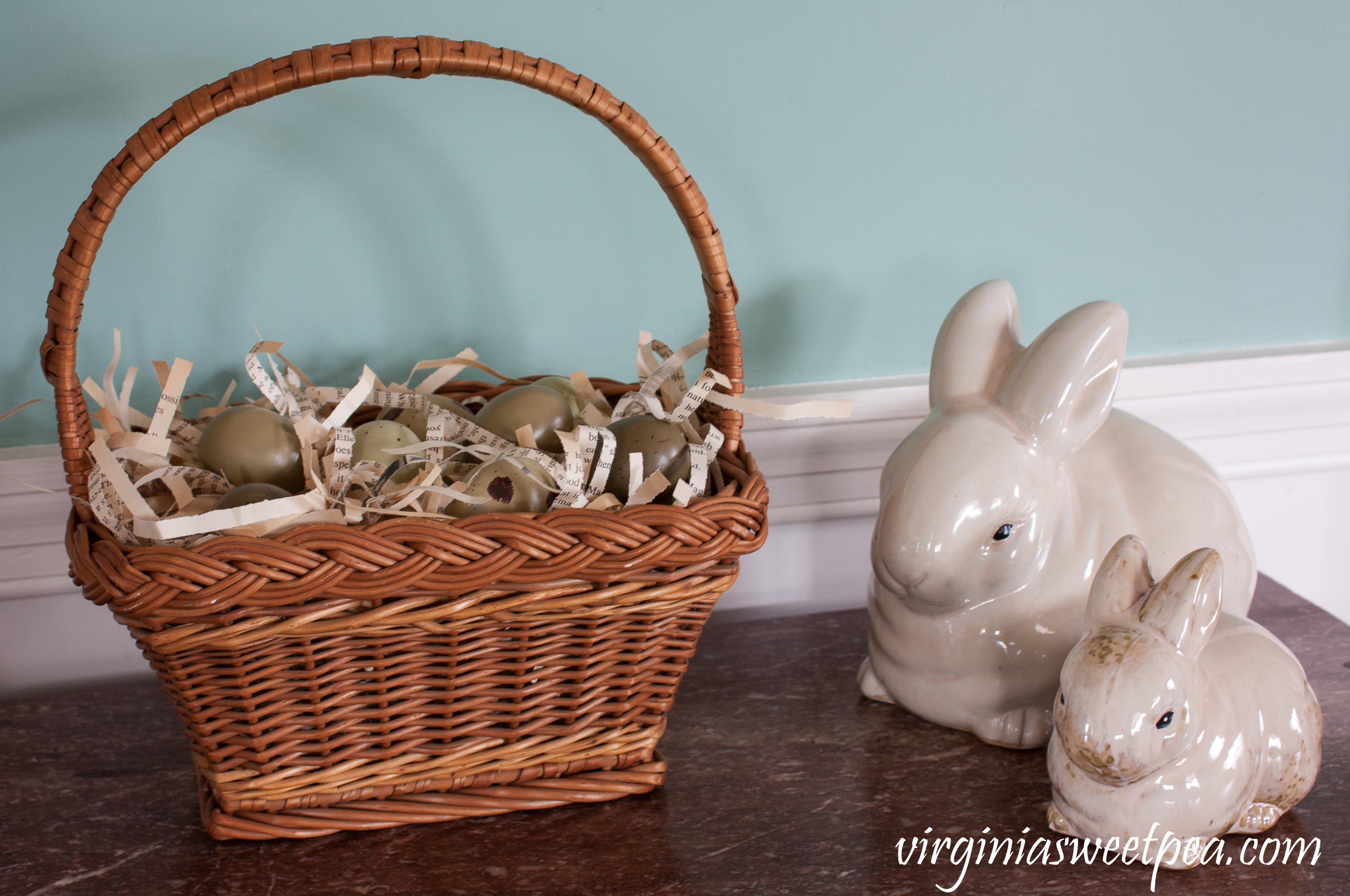 Easter Decor - Rabbits with a basket filled with shredded book pages and eggs