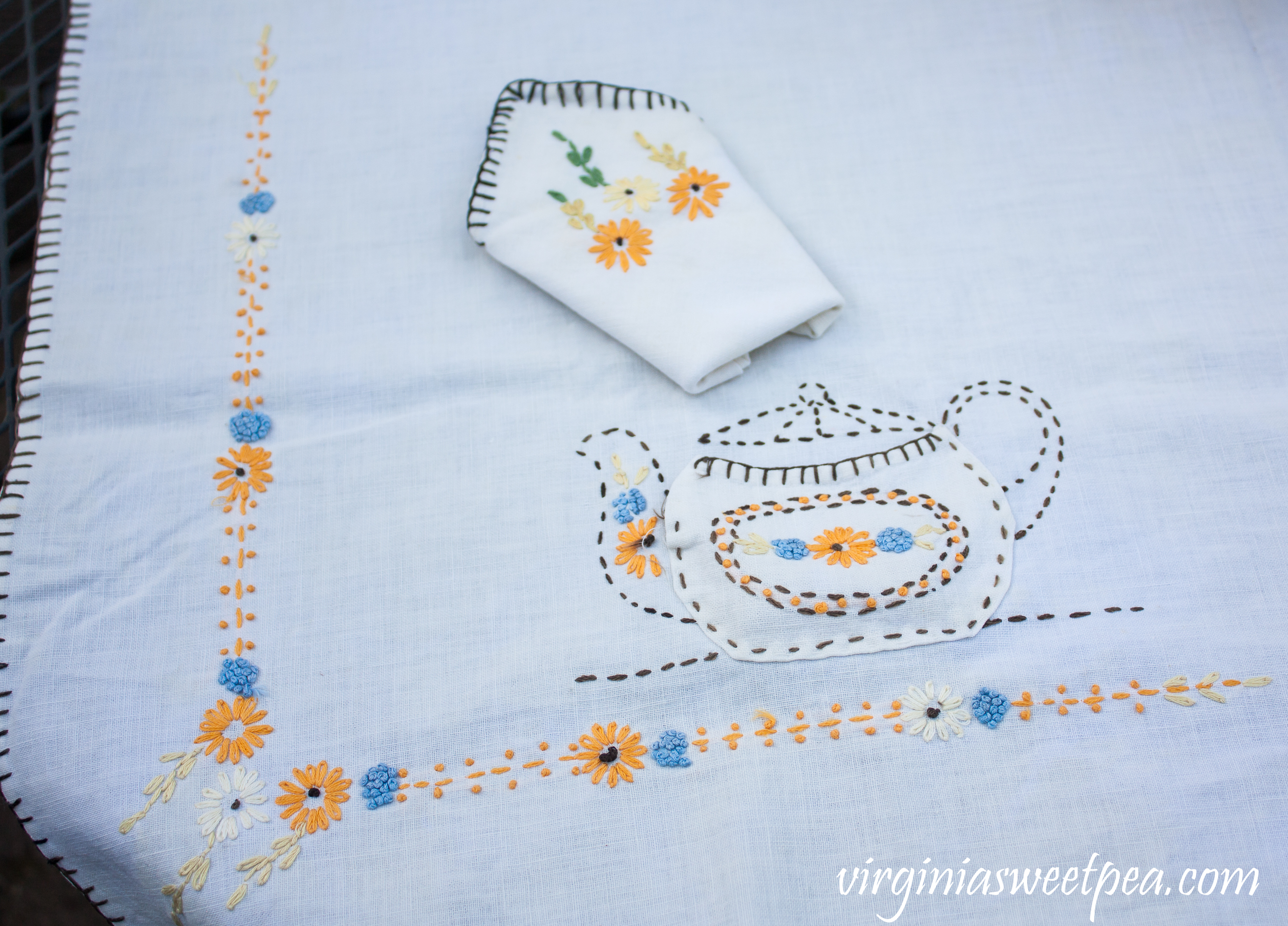 Embroidered Tablecloth from the early 1930's featuring tea pots.