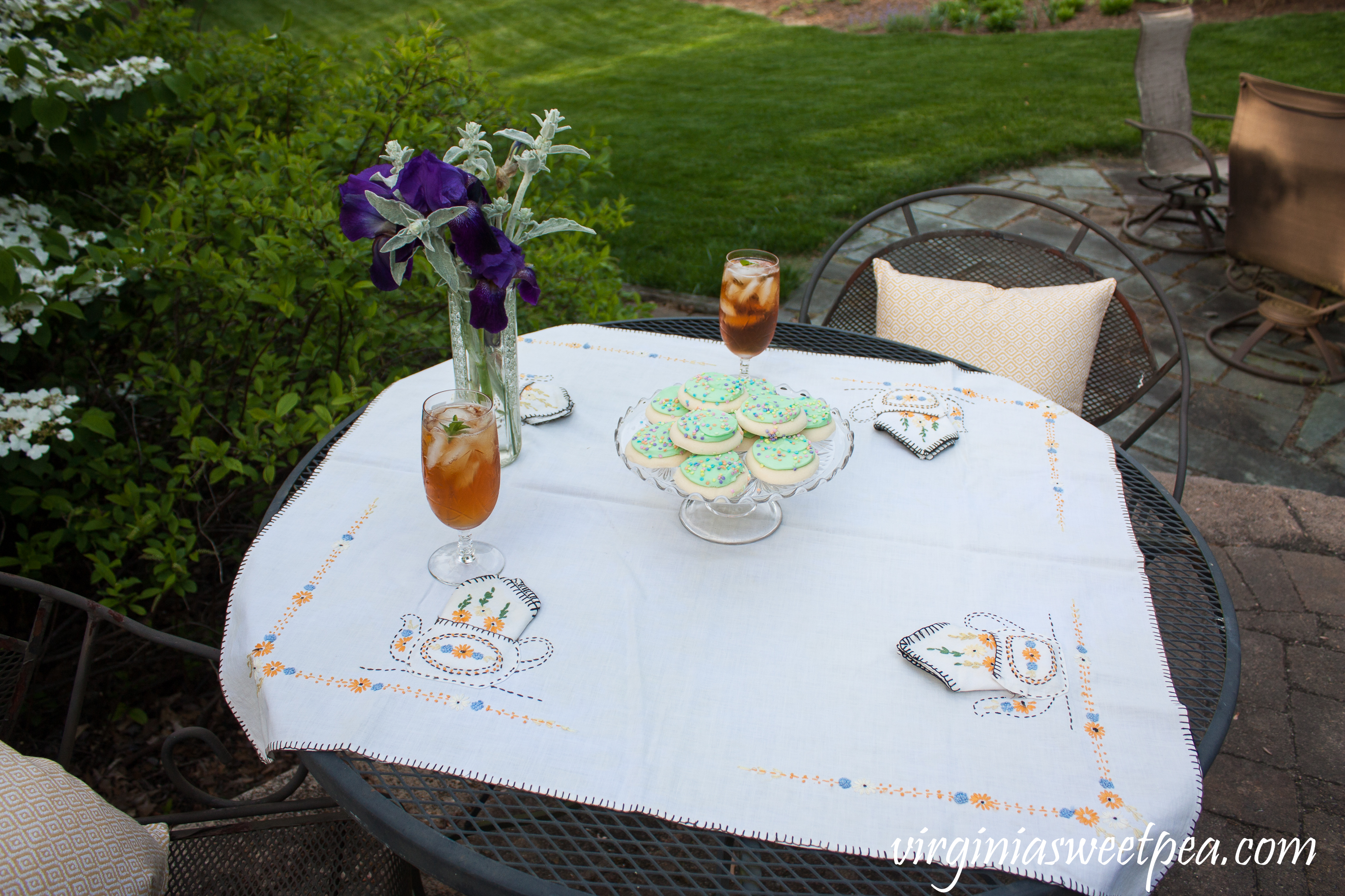 Spring Tea Party featuring a tea party themed embroidered tablecloth from the early 1930's.