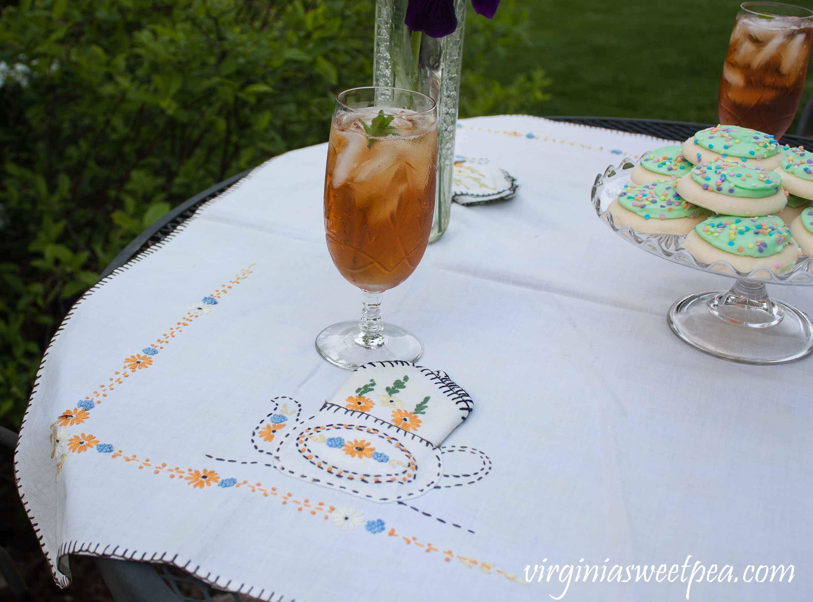 Villars by Rock Sharpe crystal with a 1930's tea party themed embroidered tablecloth