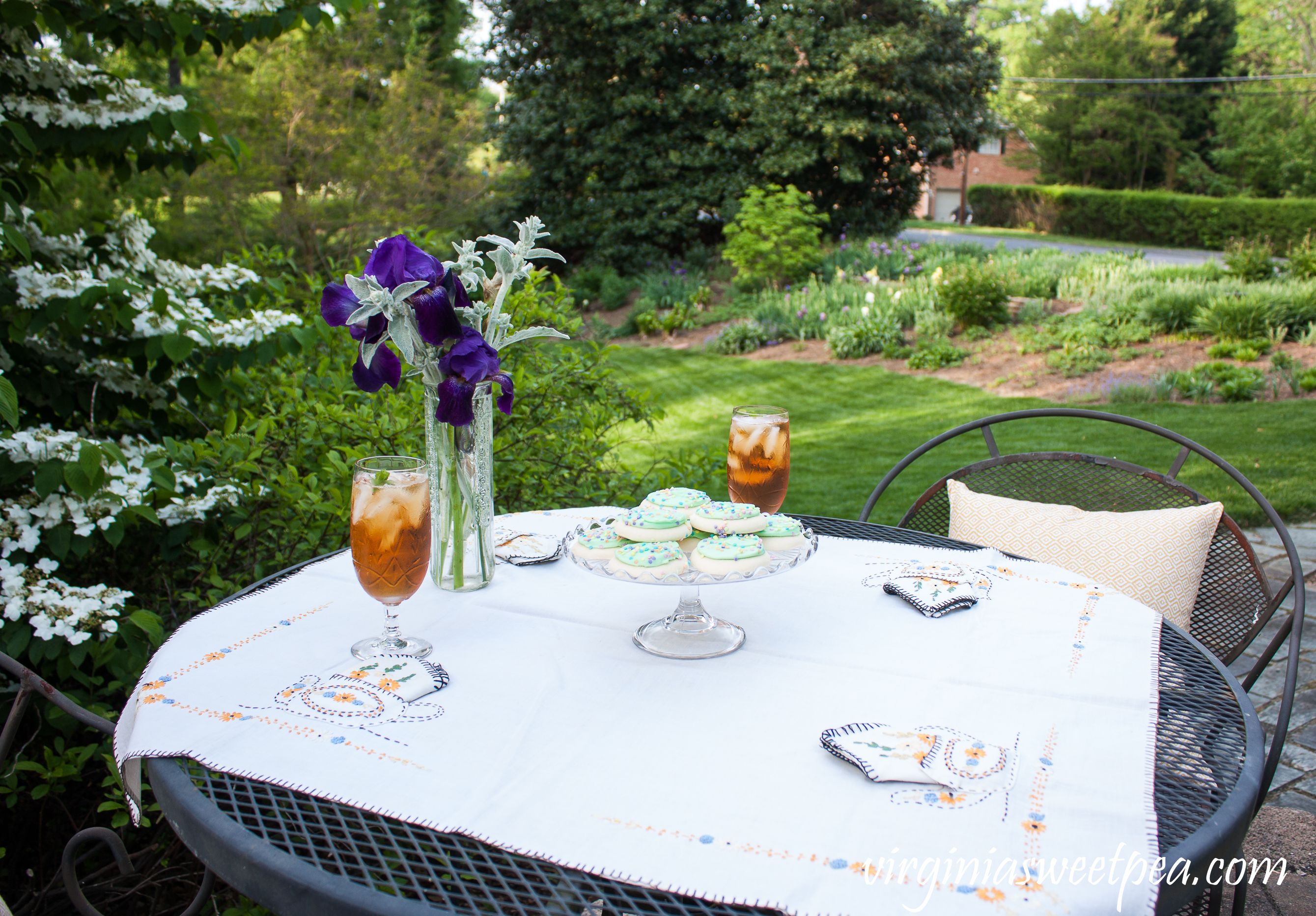 Spring Tea Party in the Garden with Vintage featuring a depression era tablecloth, crystal, and cake server.