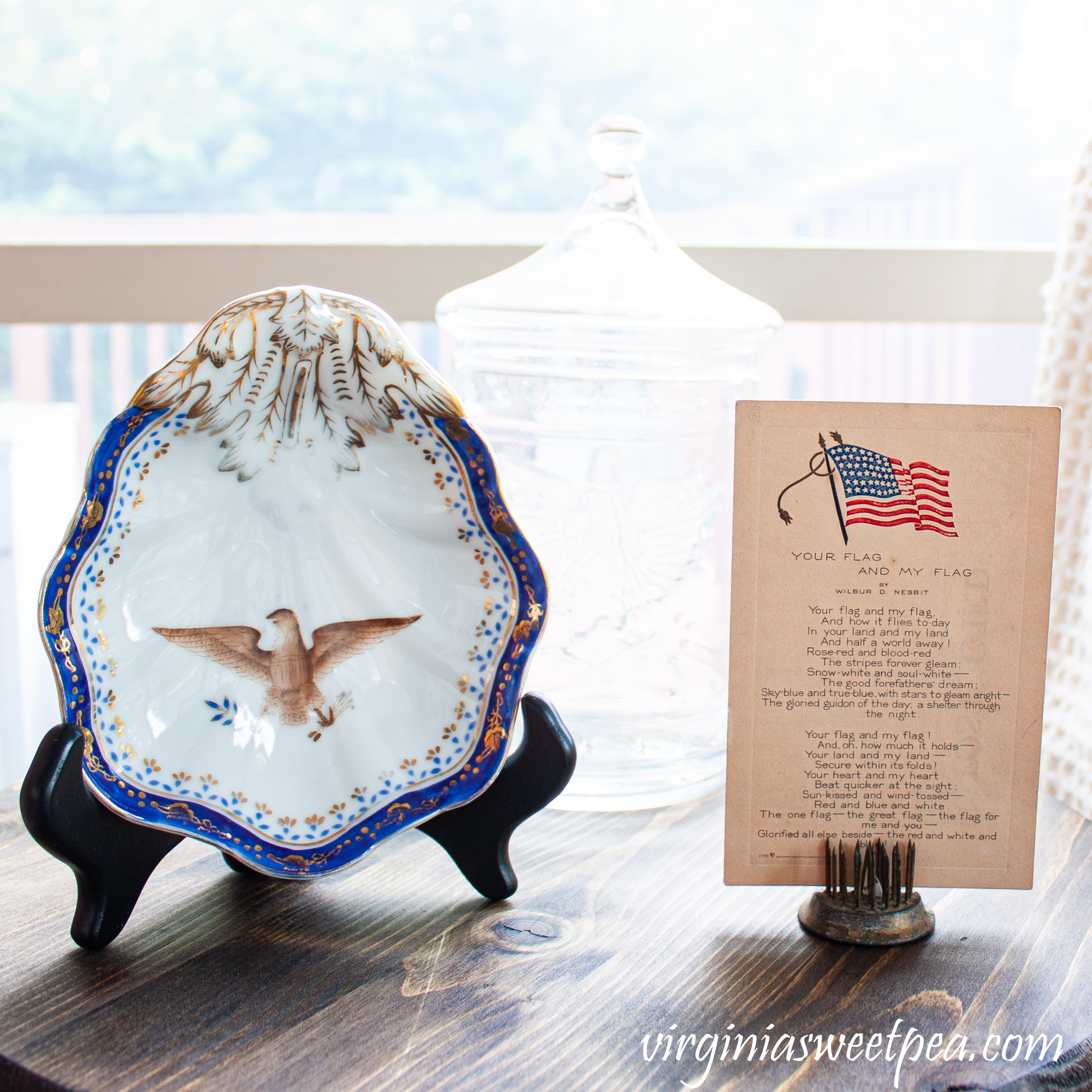 Vintage china bowl with an eagle and a vintage flag postcard