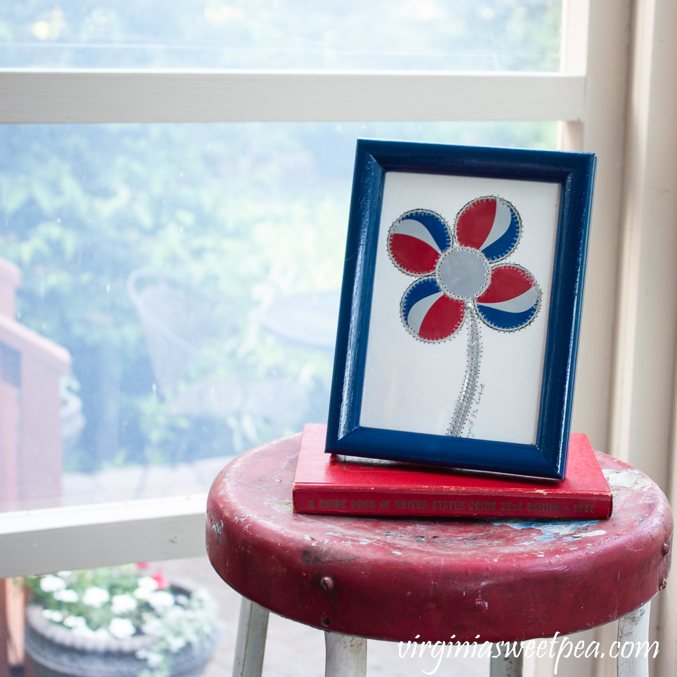 Patriotic card with a flower made from cut up Pepsi can pieces