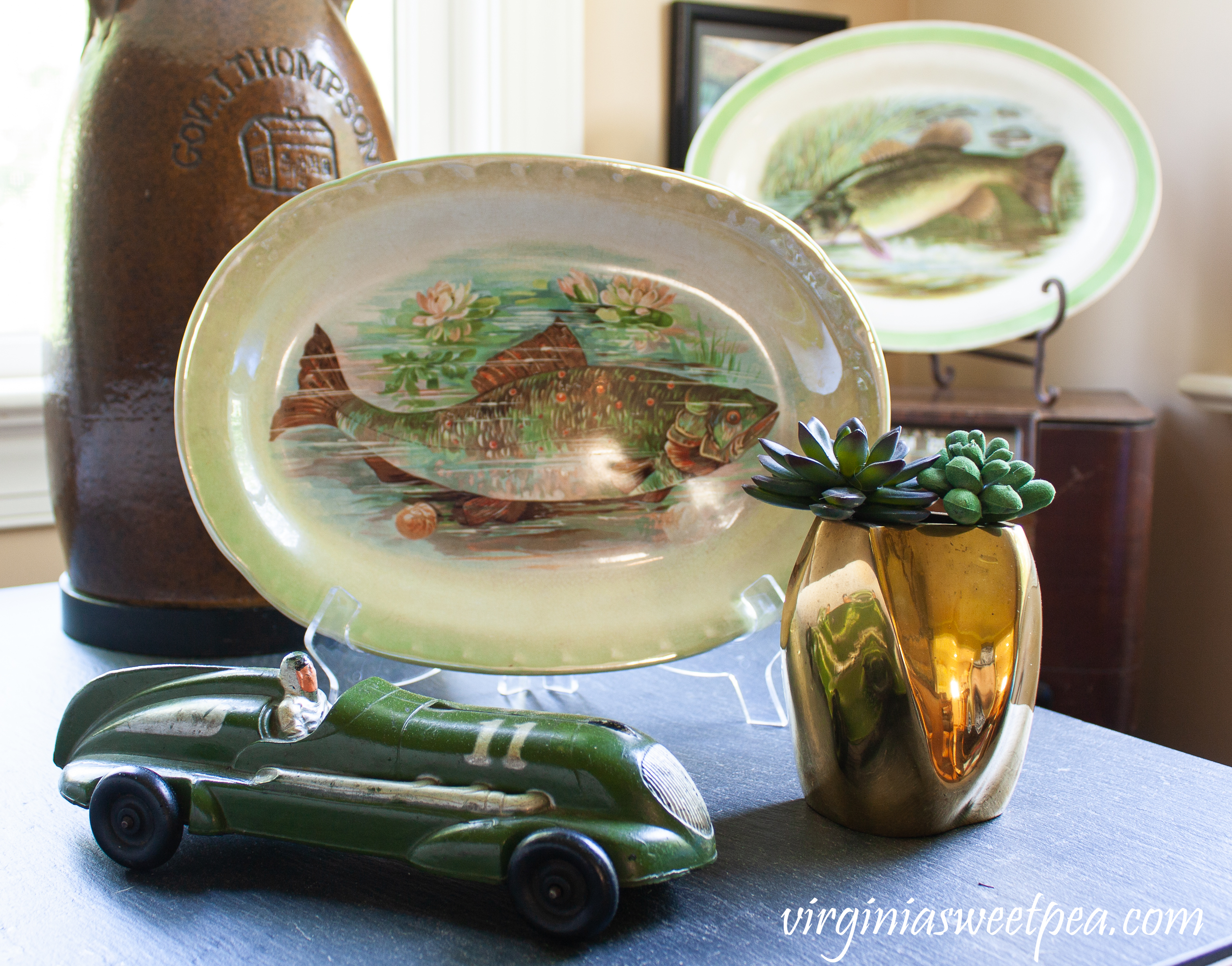 Fish themed summer vignette with a 1940's toy car. 