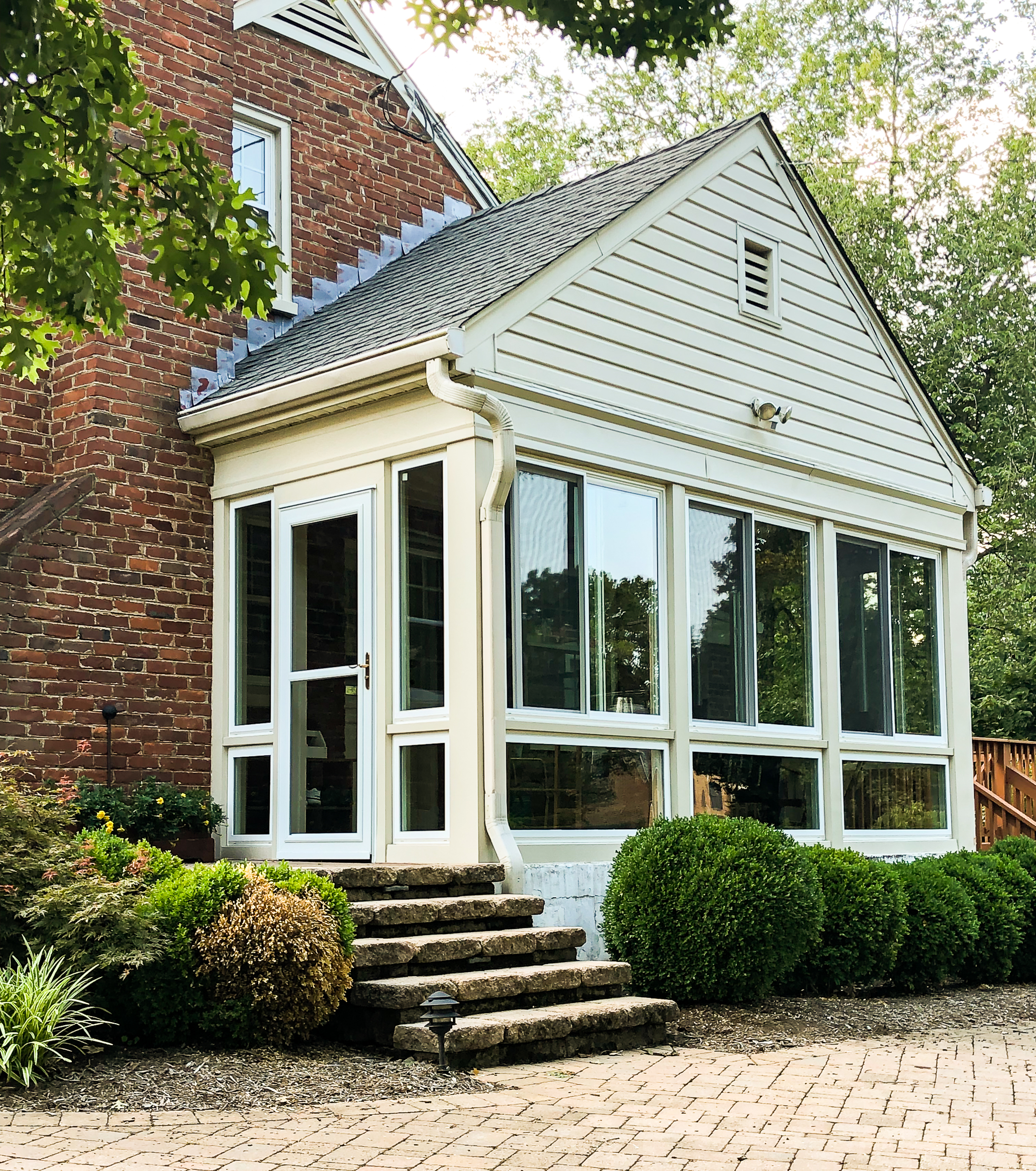 After picture of a screened porch converted to a sunroom.