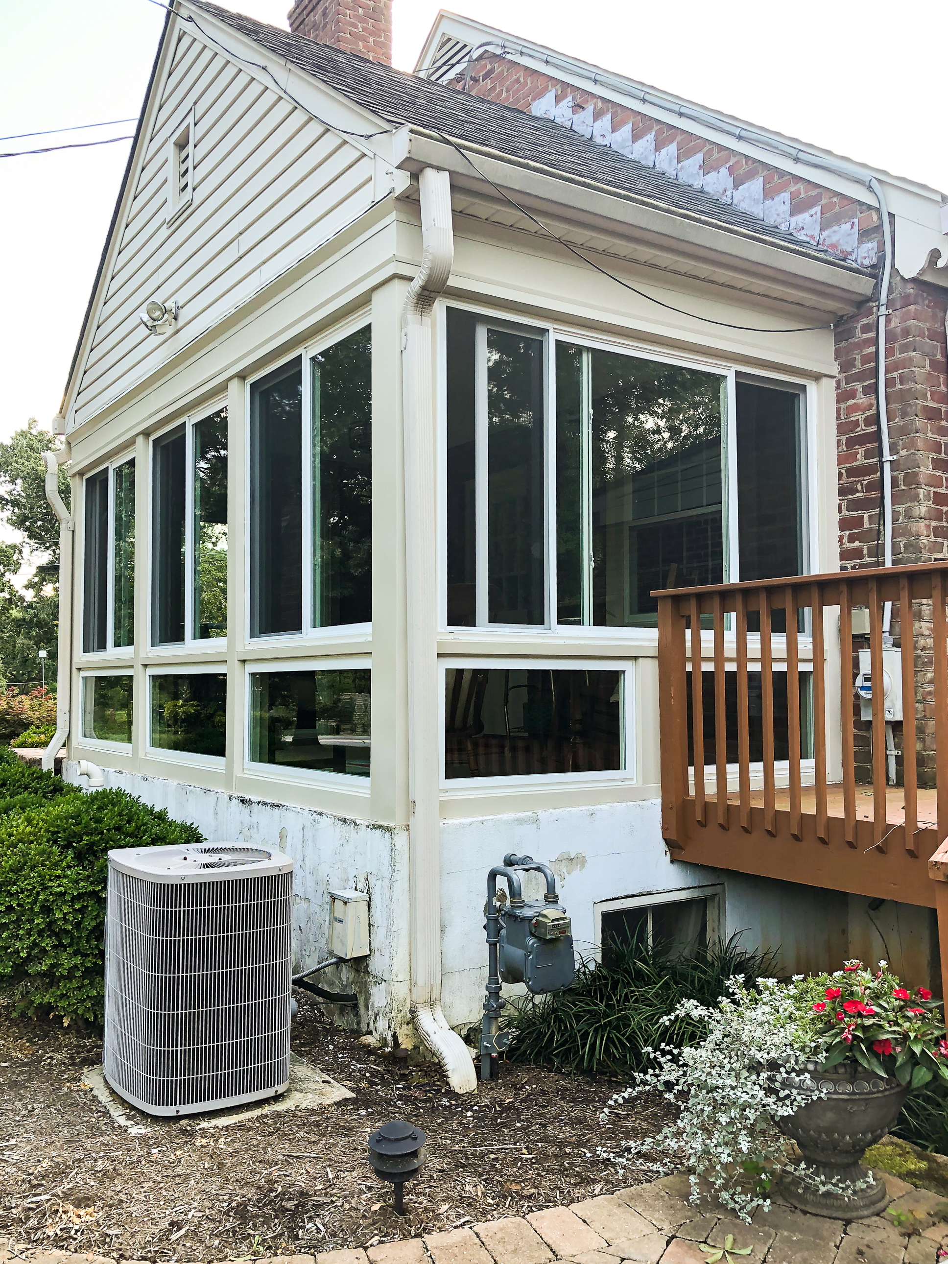 A screened porch is transformed into a sunroom. Before and After pictures.