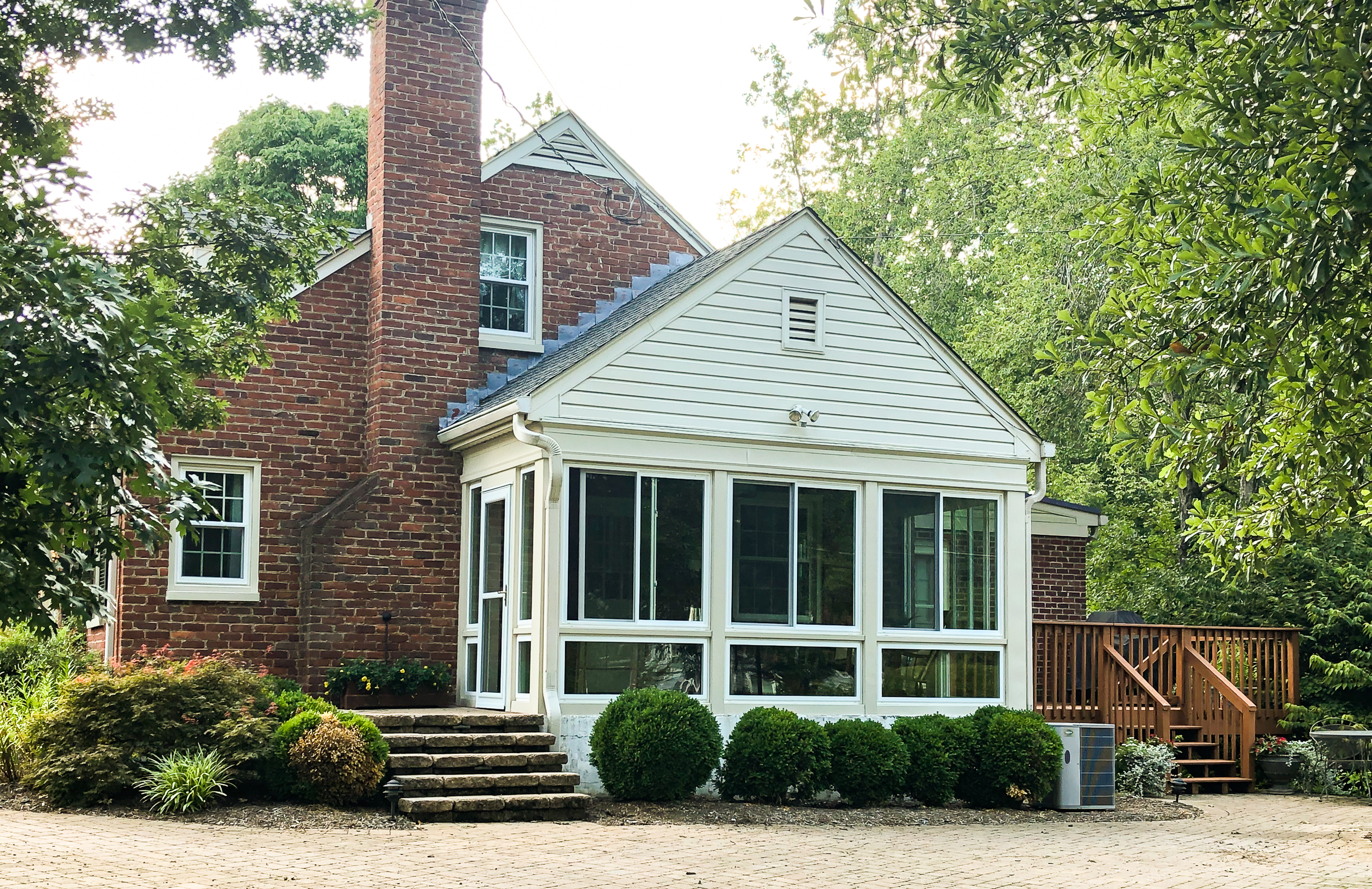 After picture of a screened porch converted to a sunroom.