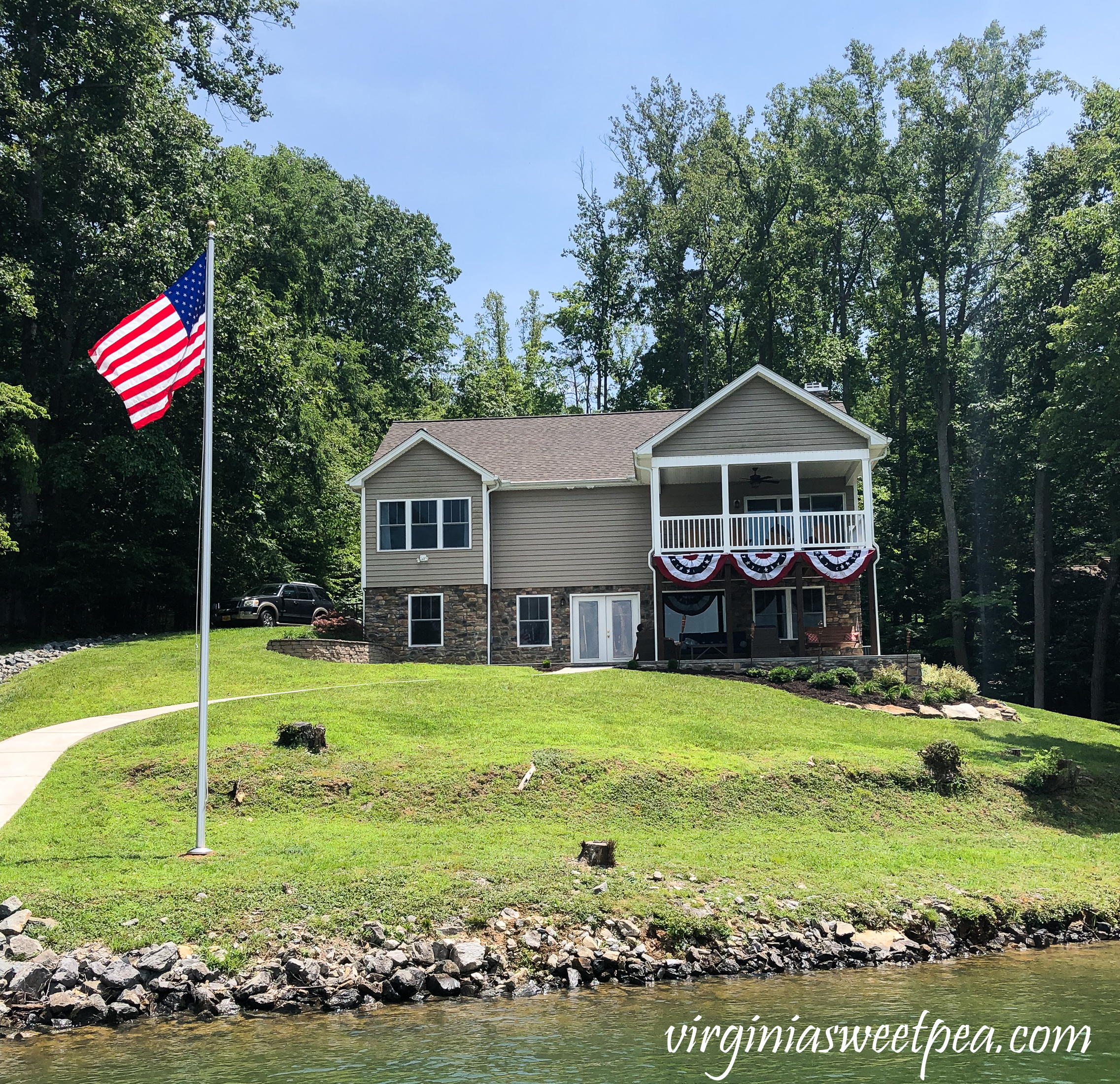 House at Smith Mountain Lake, Virginia with flagpole in the yard