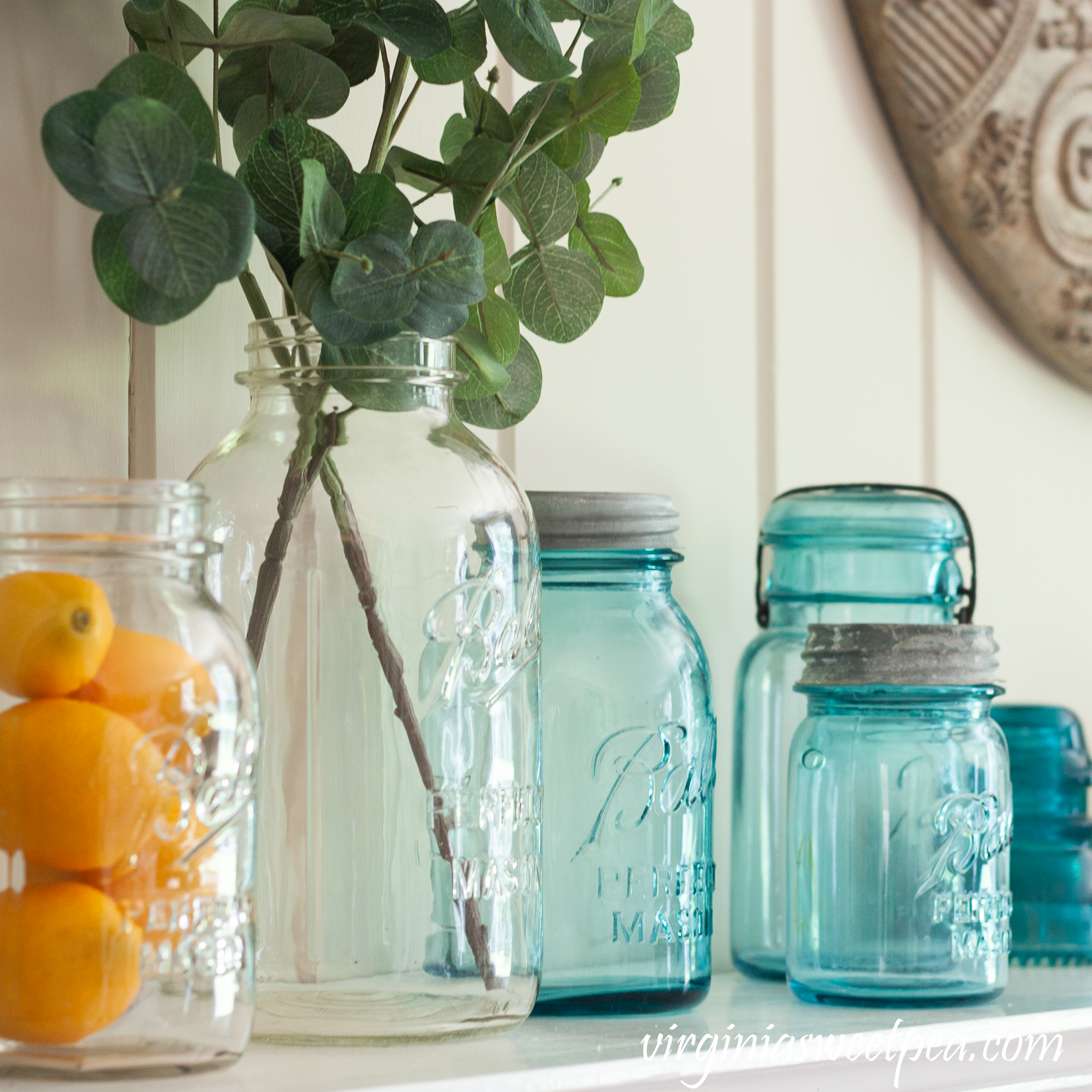 Vintage Ball Perfect Mason jars used on a summer mantel with lemons and Eucalyptus.