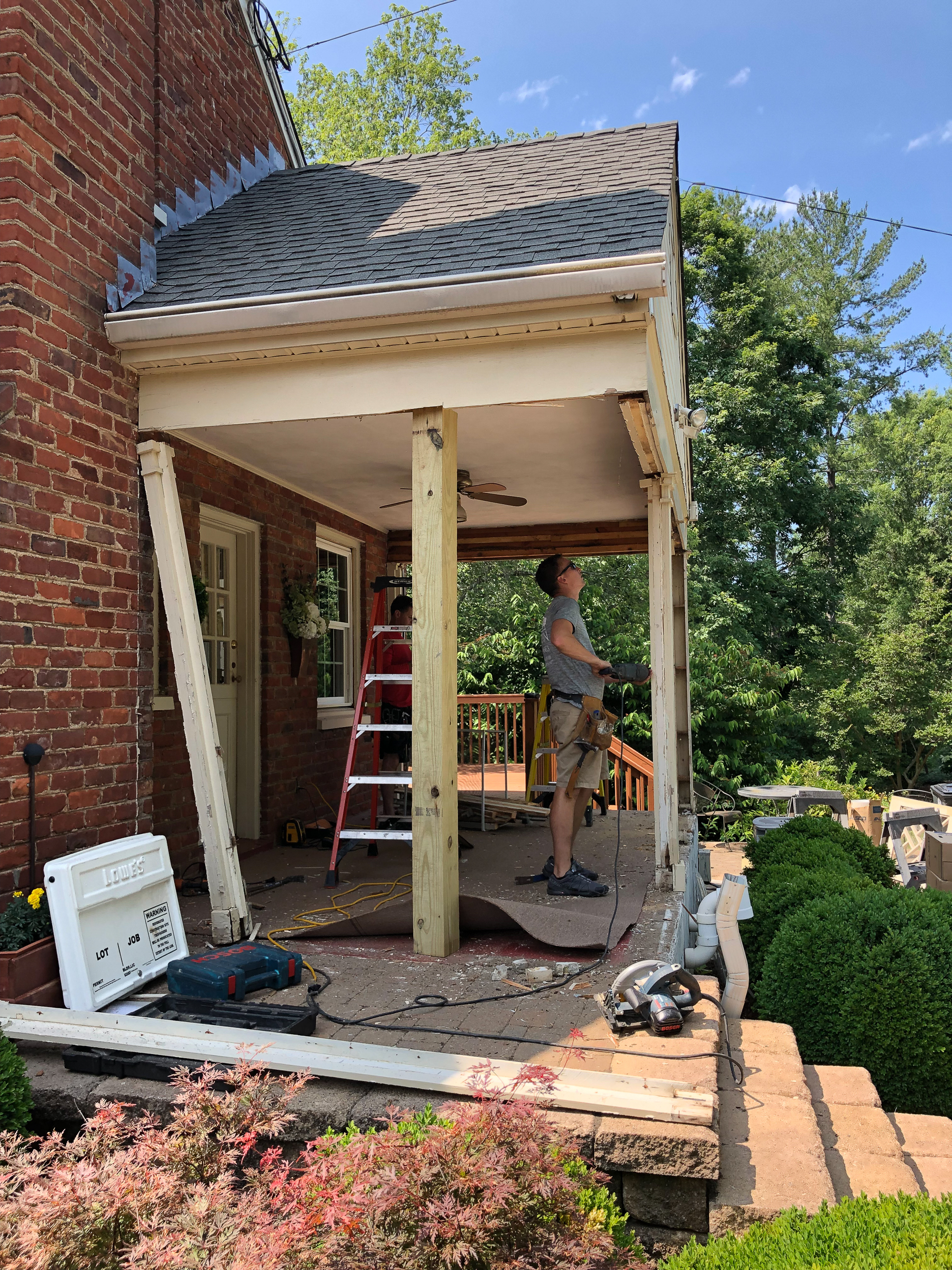 Converting a screened porch to a sunroom. Progress photo of the project.