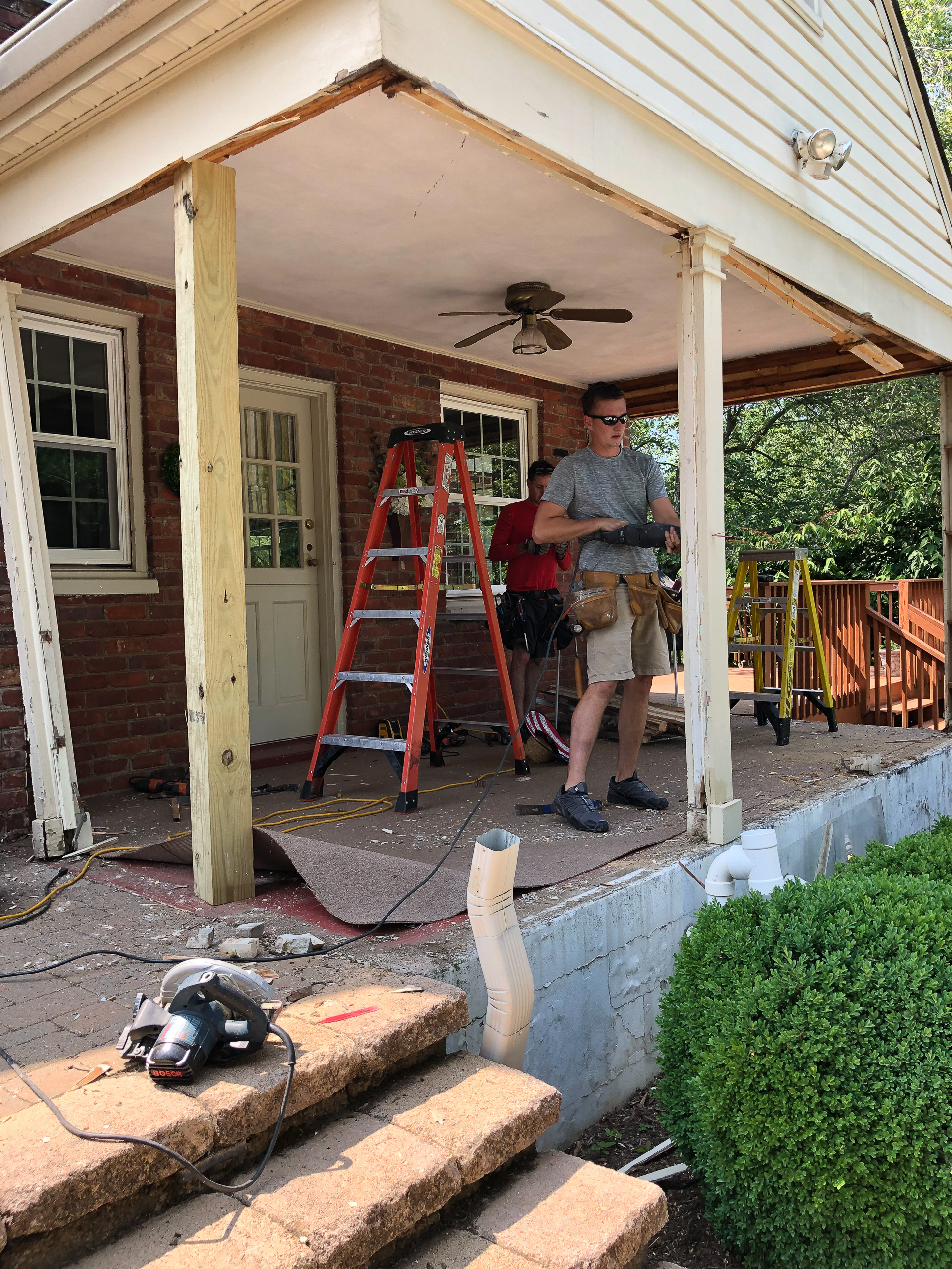 Converting a screened porch to a sunroom. Progress photo of the project.