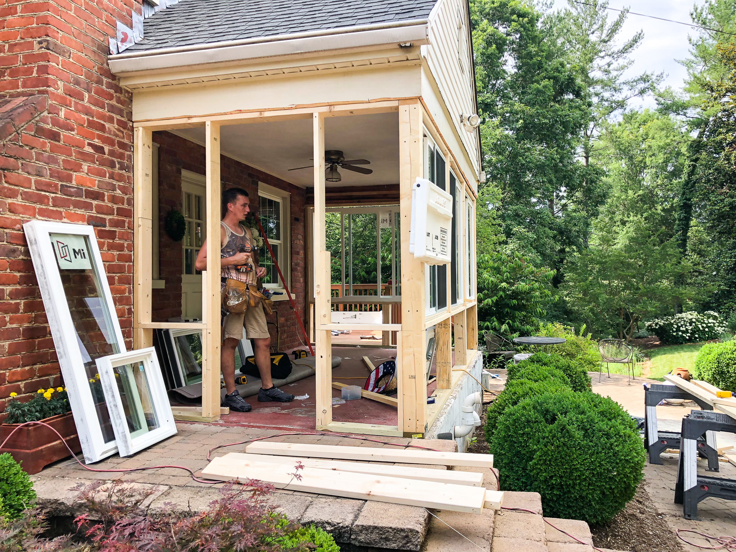 Converting a screened porch to a sunroom. Progress photo of the project.