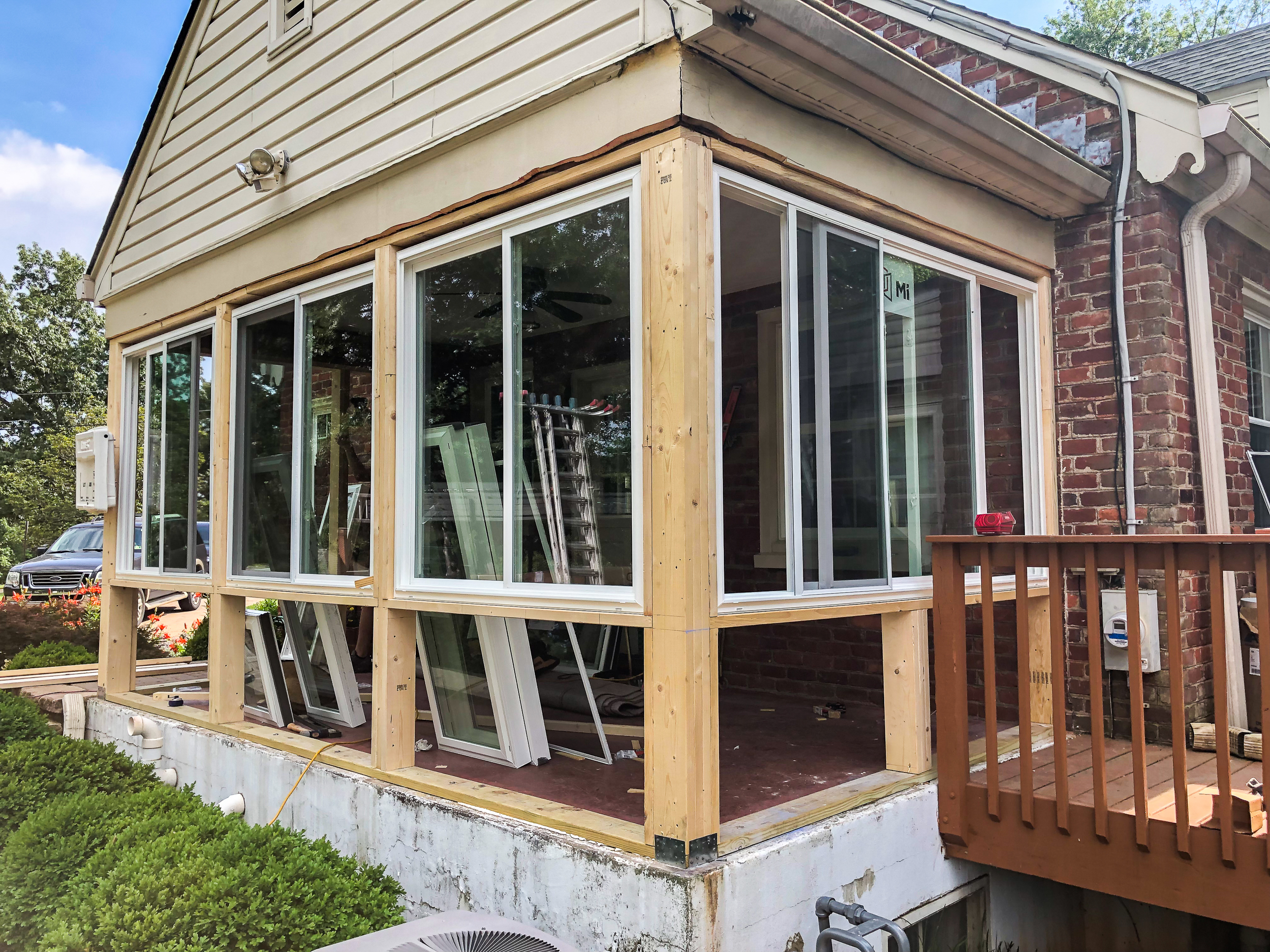 Converting a screened porch to a sunroom. Progress photo of the project.