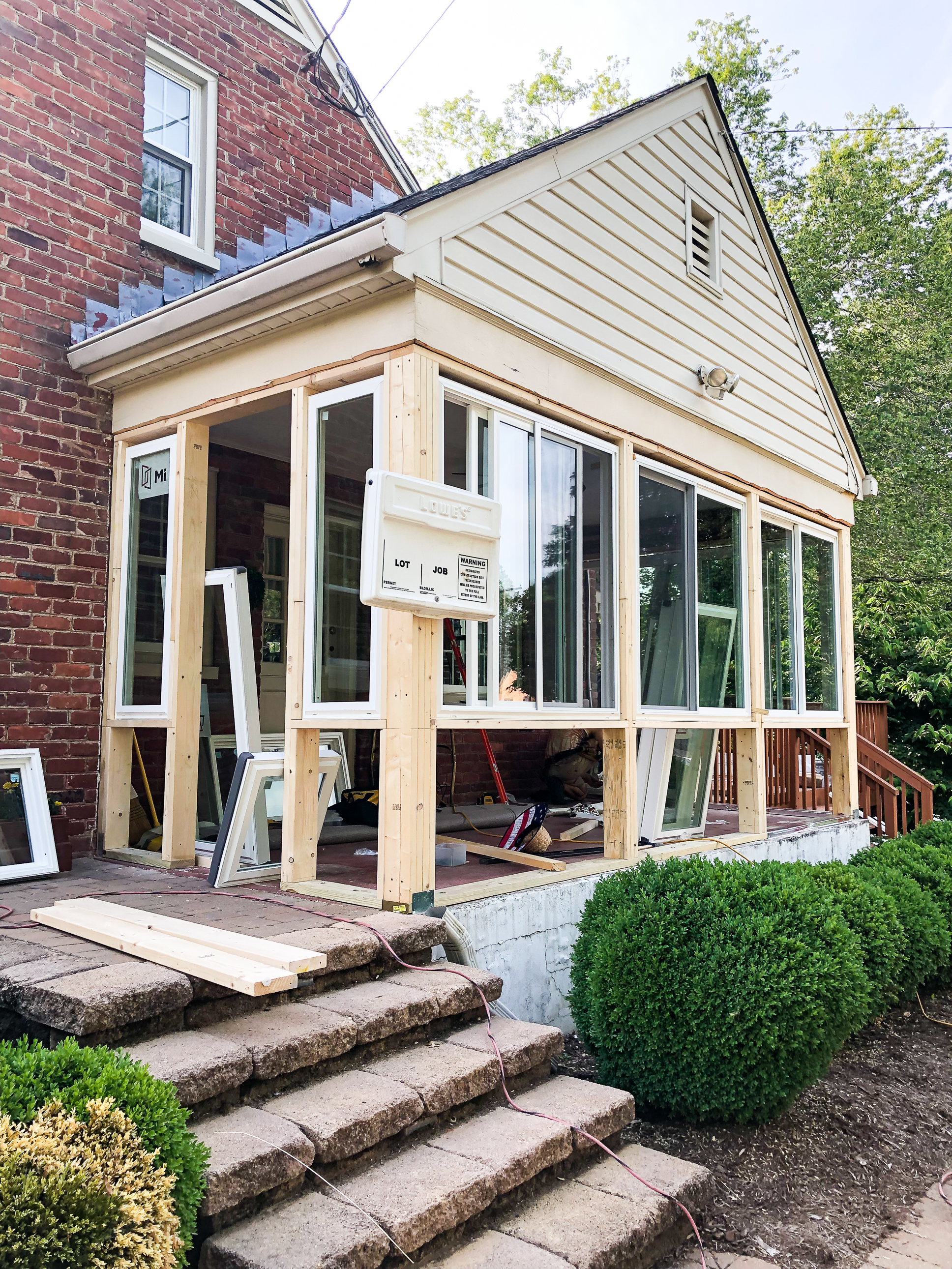 Converting a screened porch to a sunroom. Progress photo of the project.