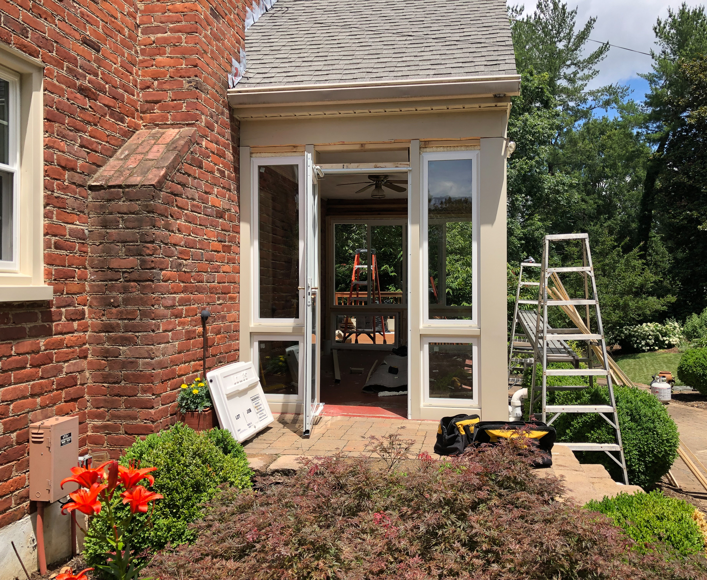 Converting a screened porch to a sunroom. Progress photo of the project.