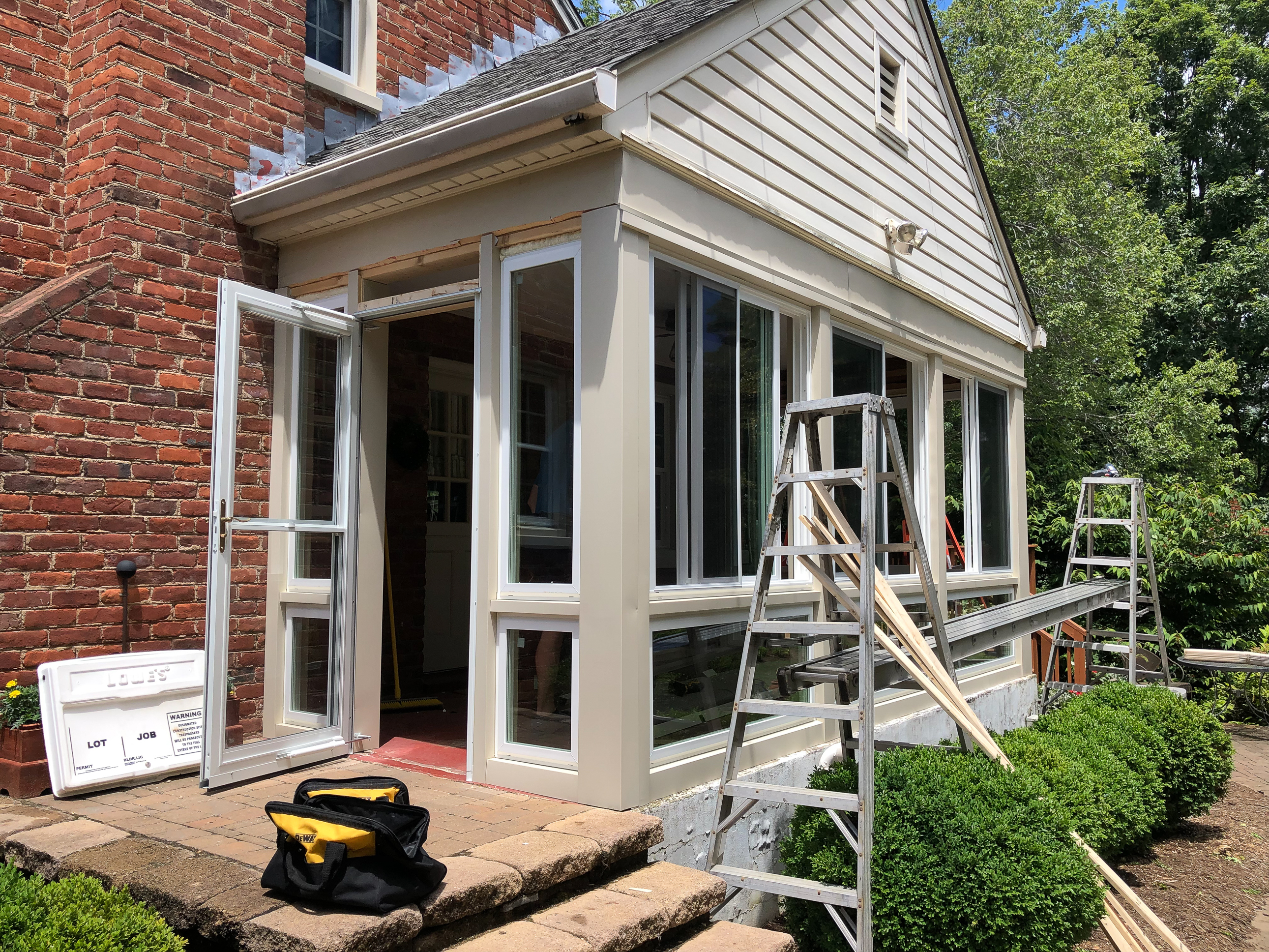 Converting a screened porch to a sunroom. Progress photo of the project.