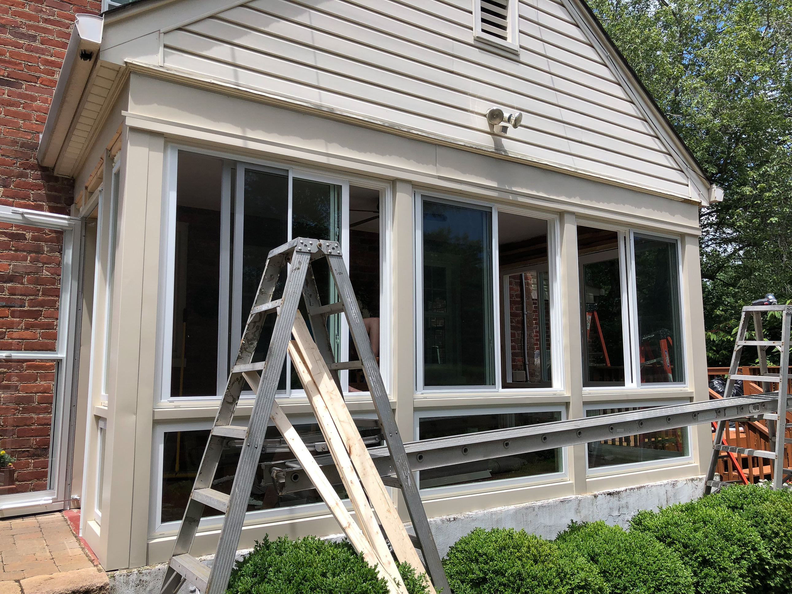 Converting a screened porch to a sunroom. Progress photo of the project.