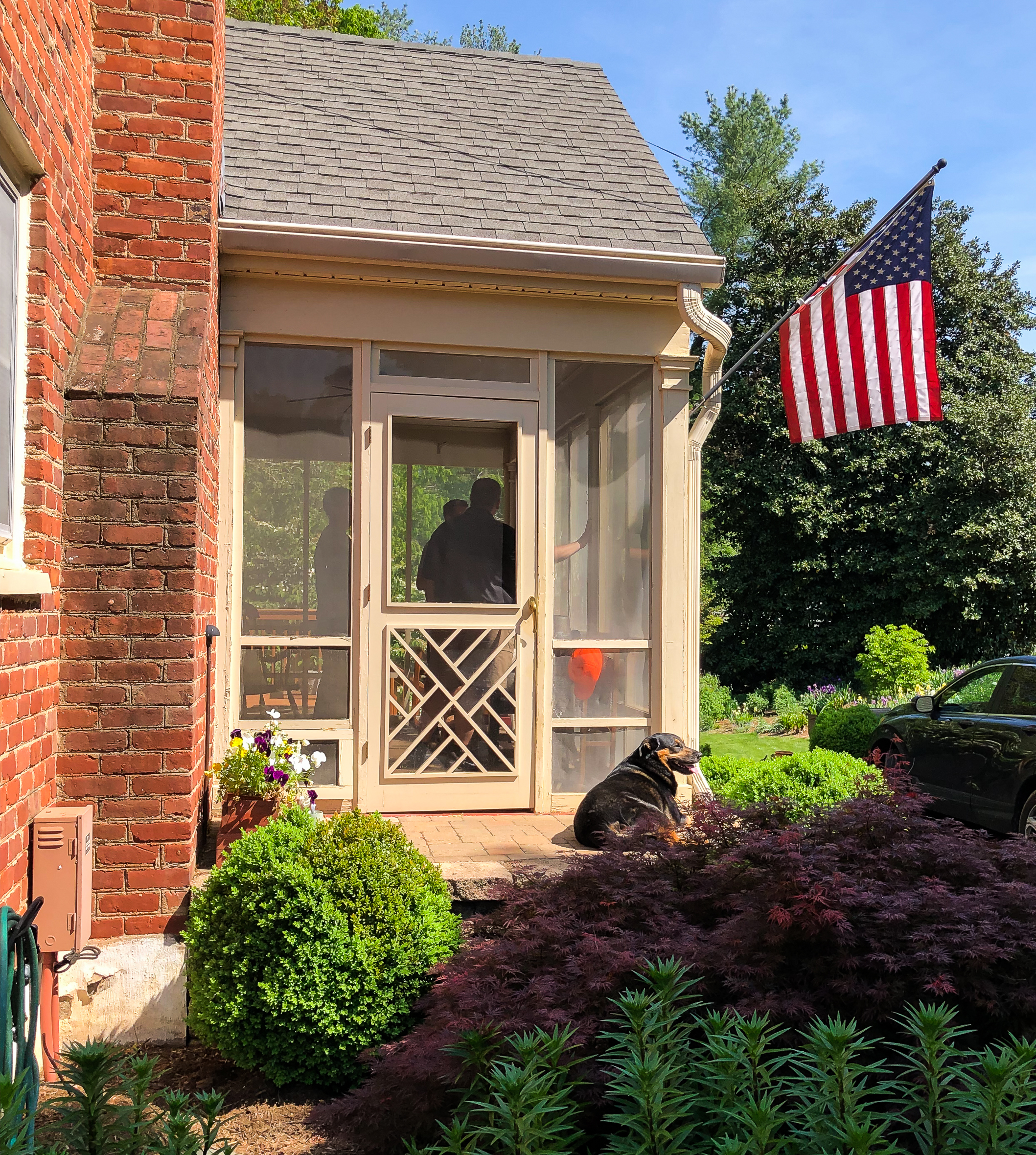 Before picture of a screened porch being converted to a sunroom.