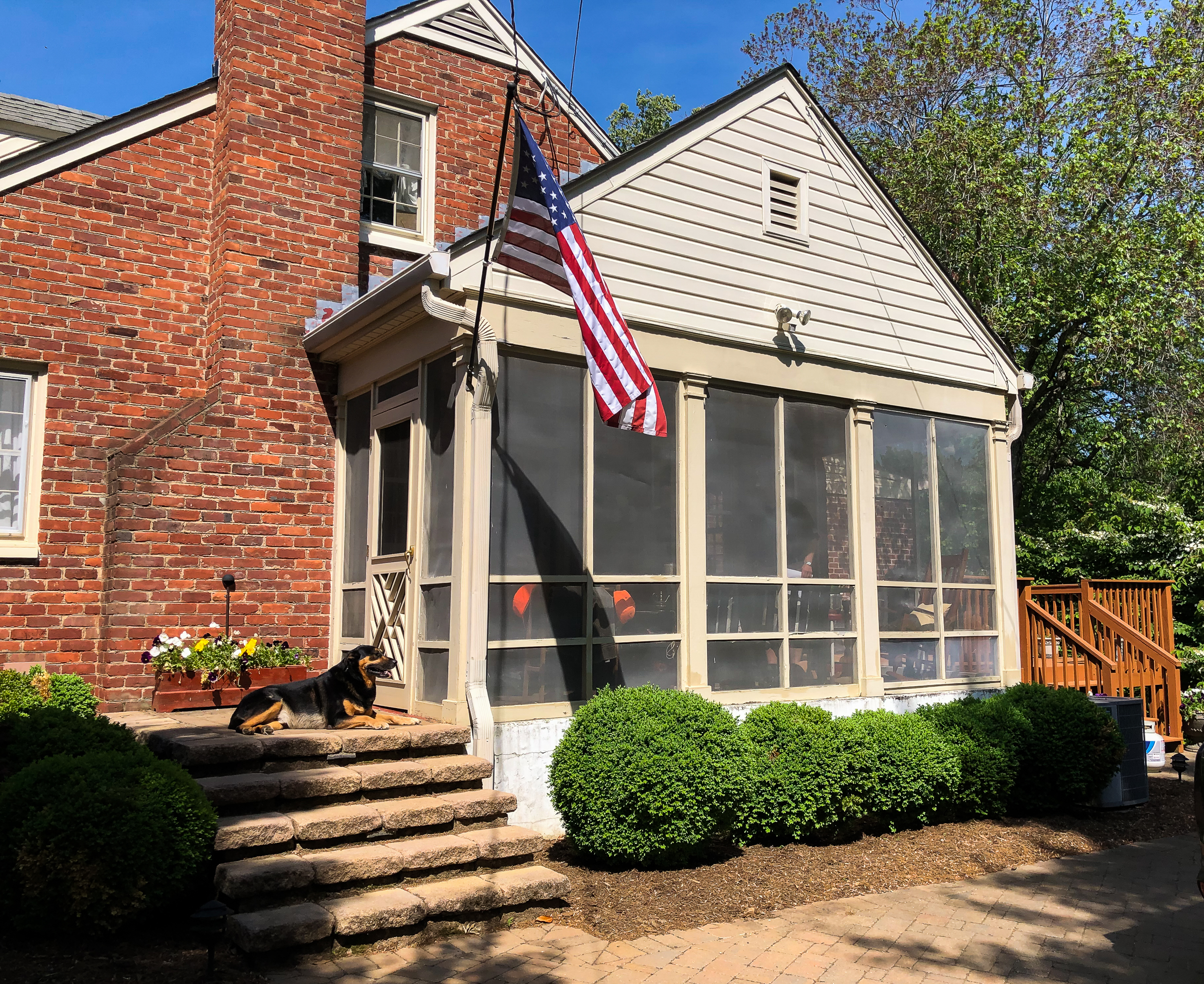 Before picture of a screened porch being converted to a sunroom.