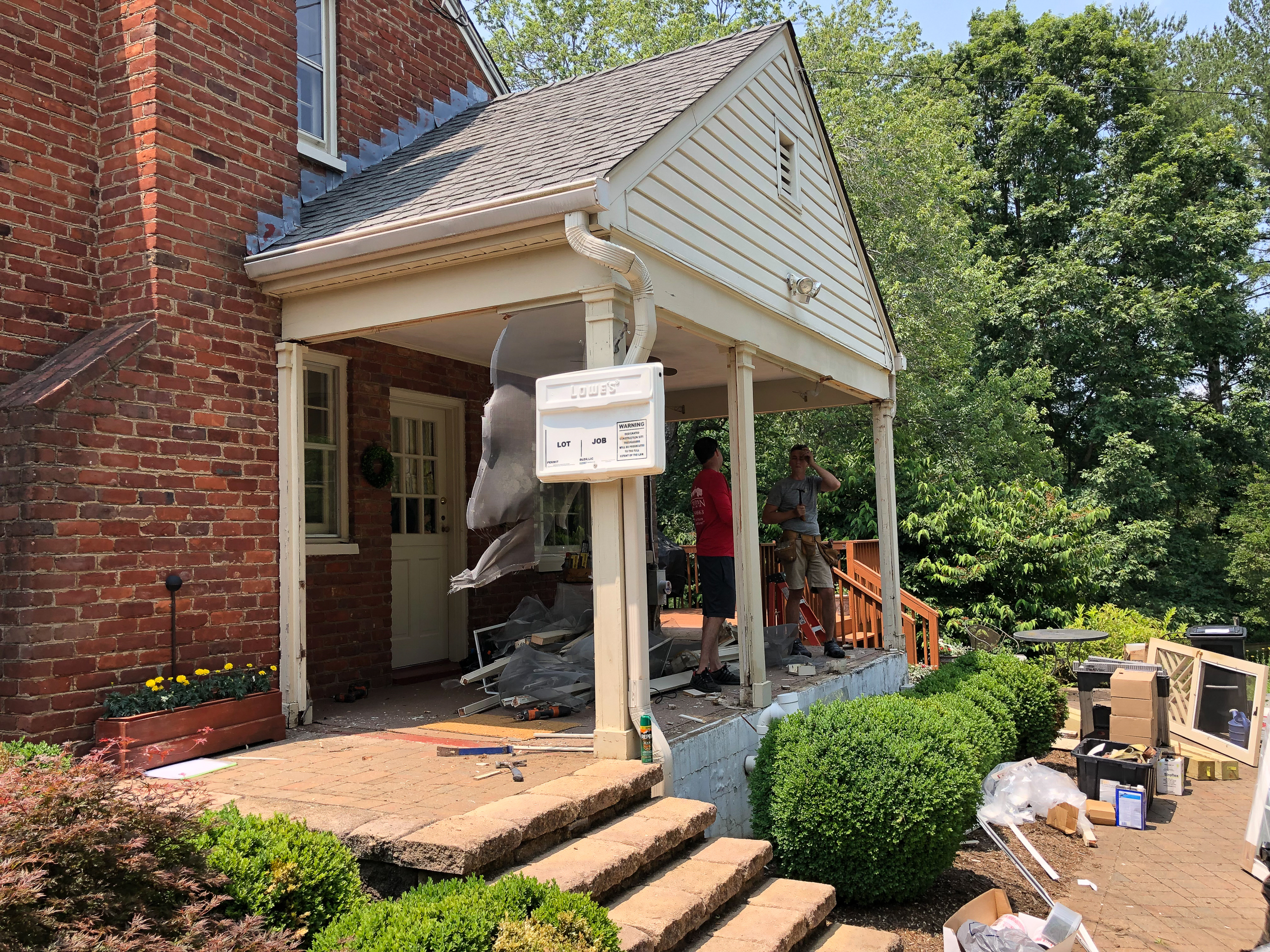 Converting a screened porch to a sunroom. Progress photo of the project.