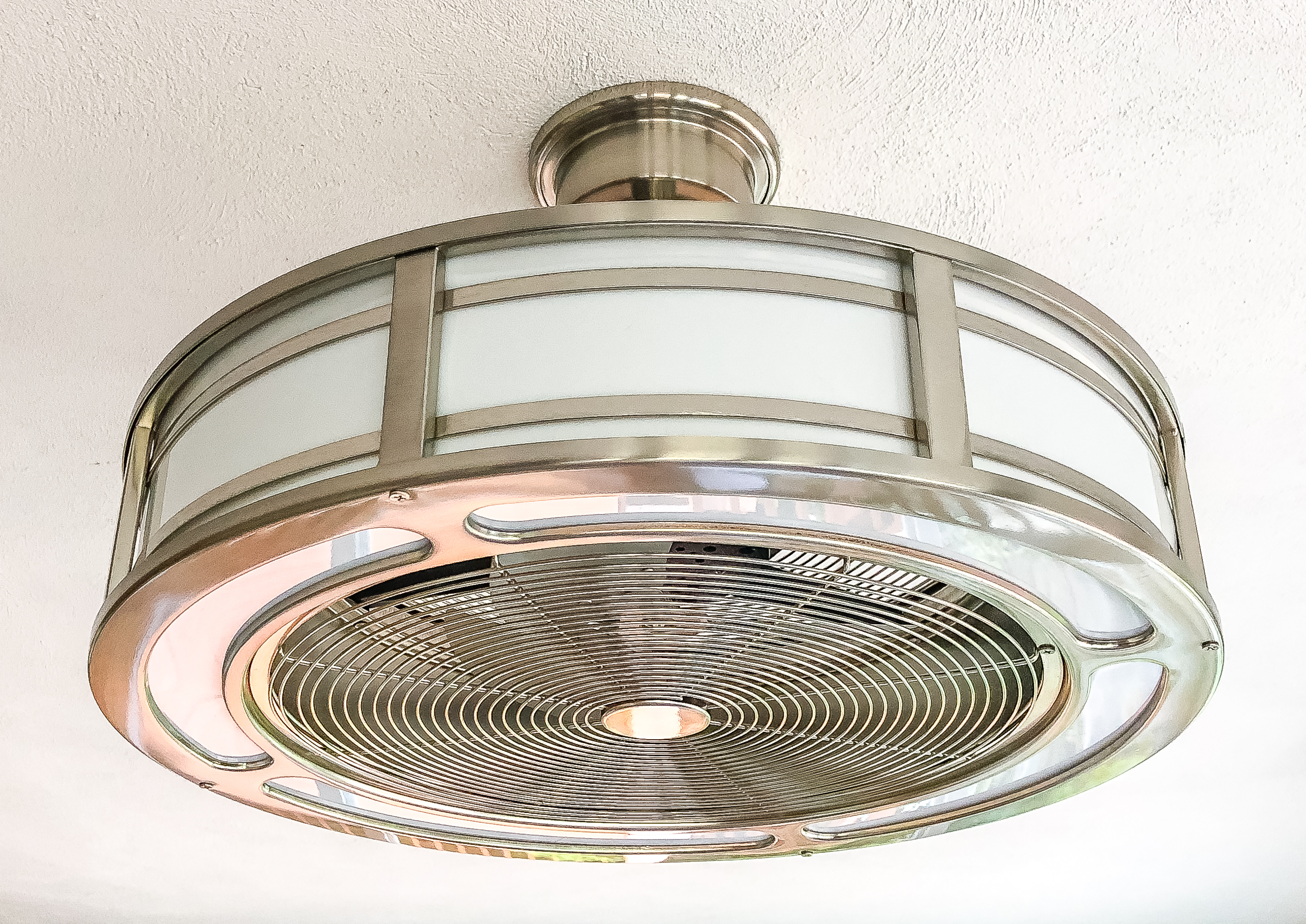 Home Decorators Collection Brette 23" Indoor/Outdoor Brushed Nickel fan from Home Depot installed in a sunporch.