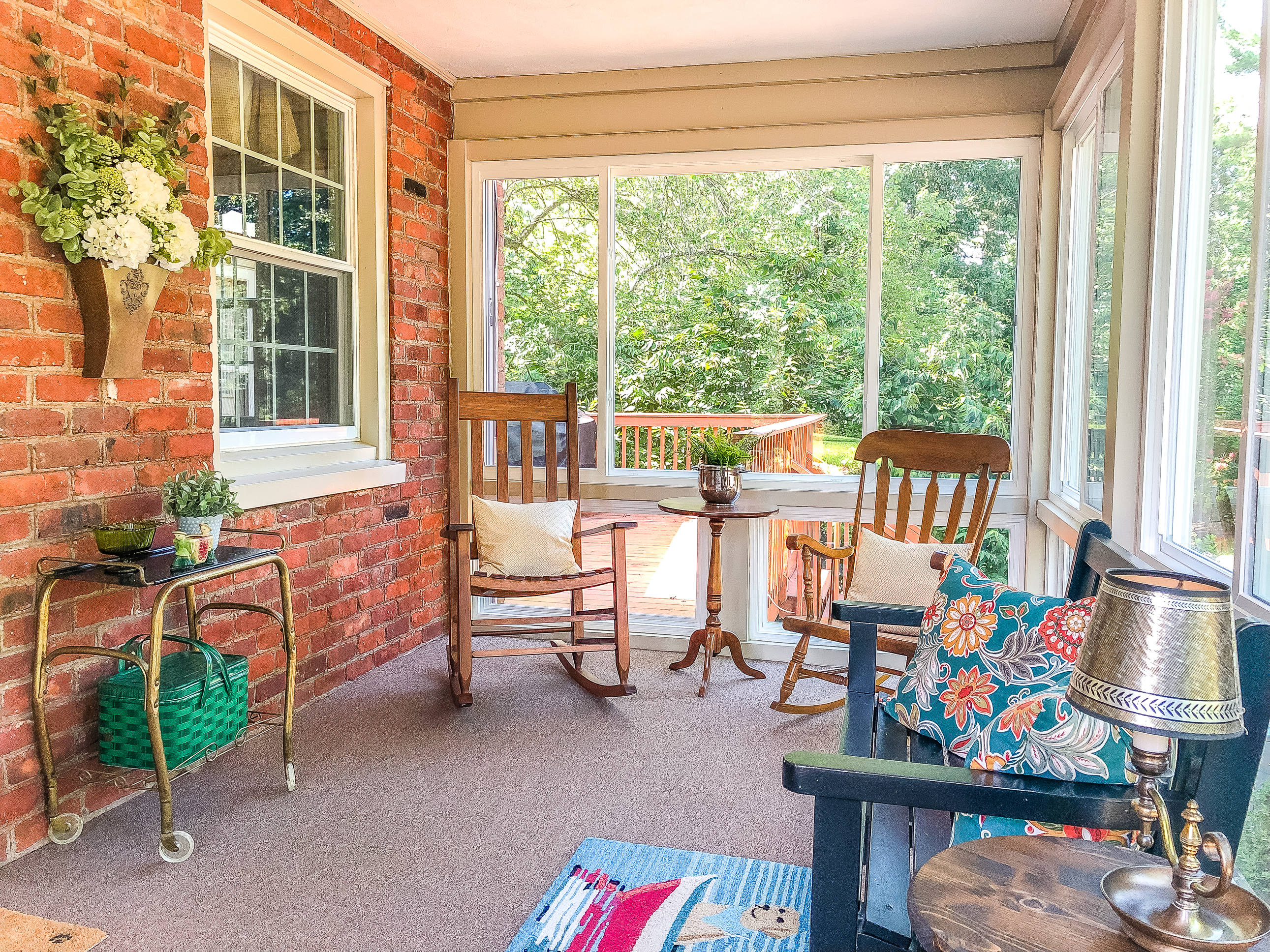 Interior pictures of a screened porch converted to a sunroom.