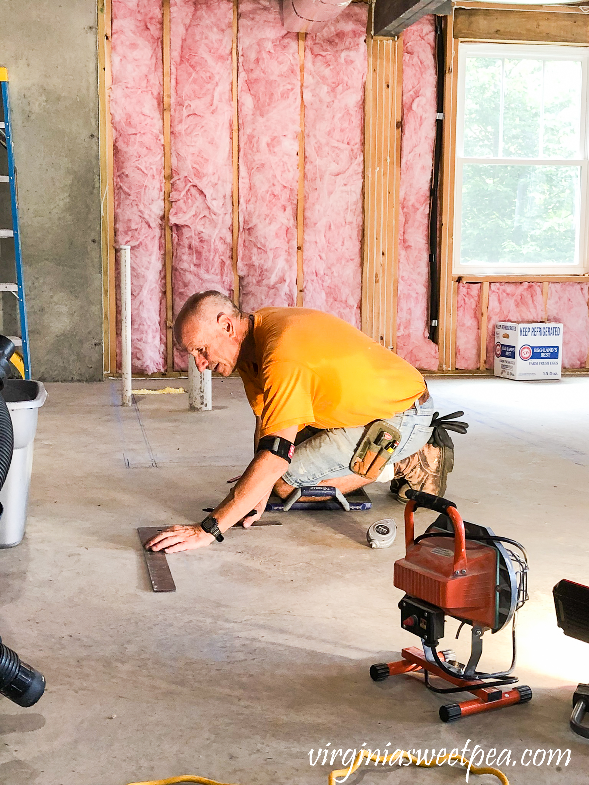 Marking the floor for the wall studs