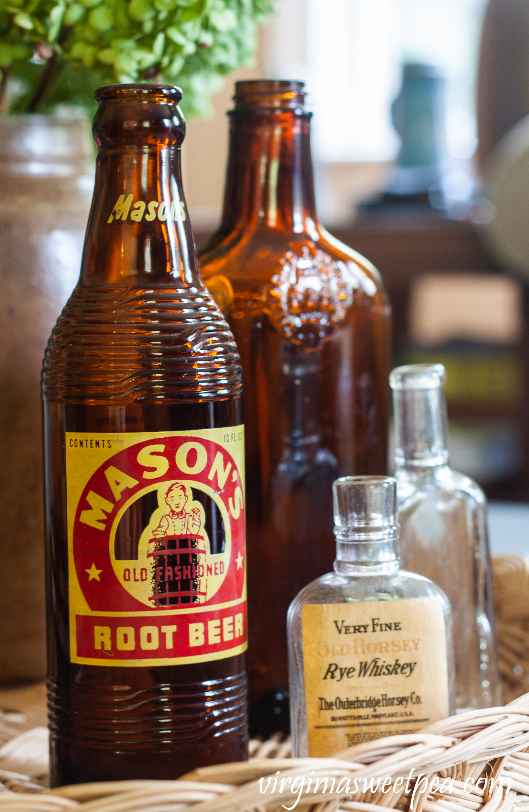 Mason's Root Beer bottle, Very Fine Old Horsey Rye Whiskey bottle, a brown liquor bottle and a small clear glass bottle.