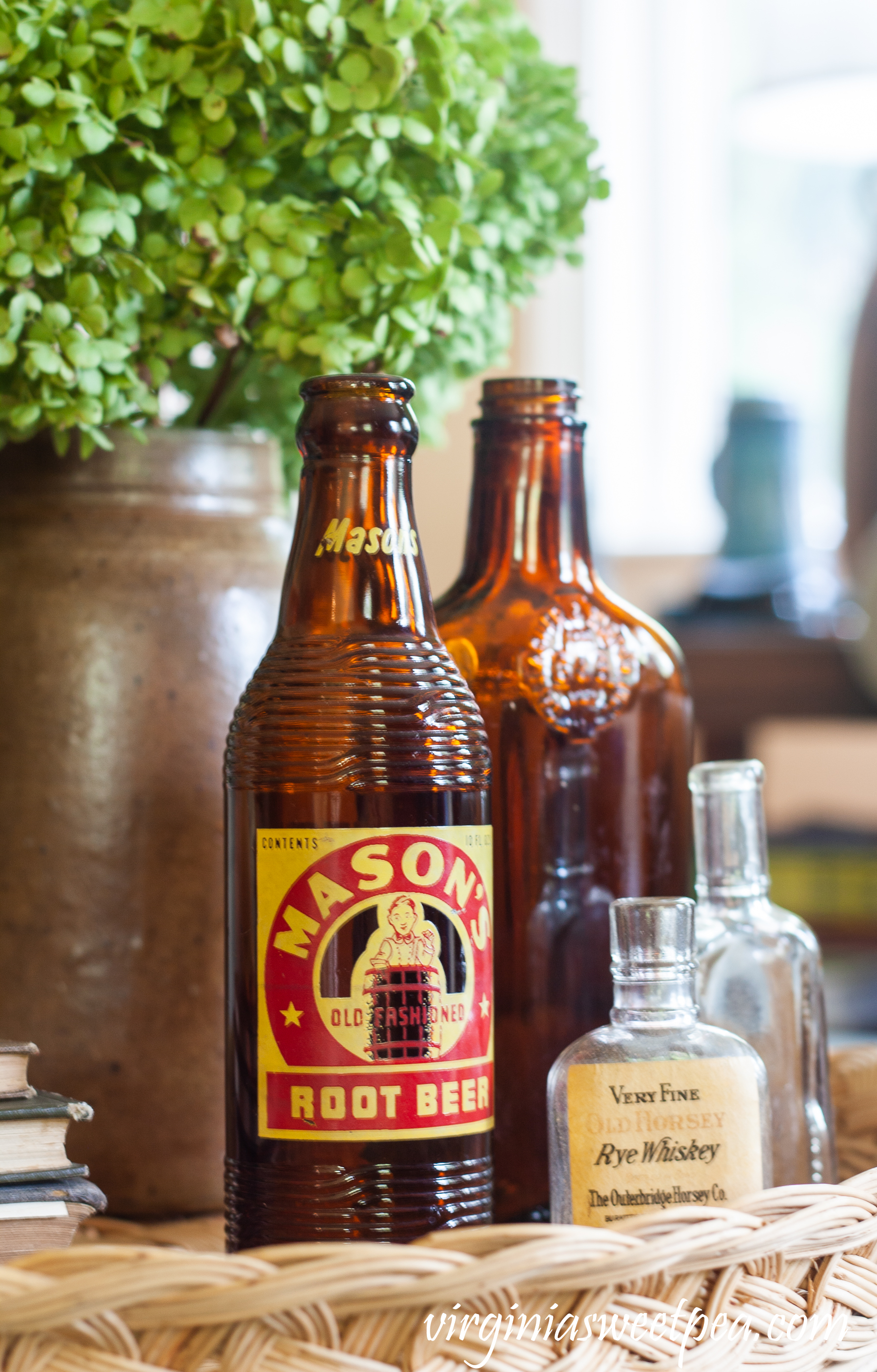 Mason's Root Beer bottle, Very Fine Old Horsey Rye Whiskey bottle, a brown liquor bottle and a small clear glass bottle.