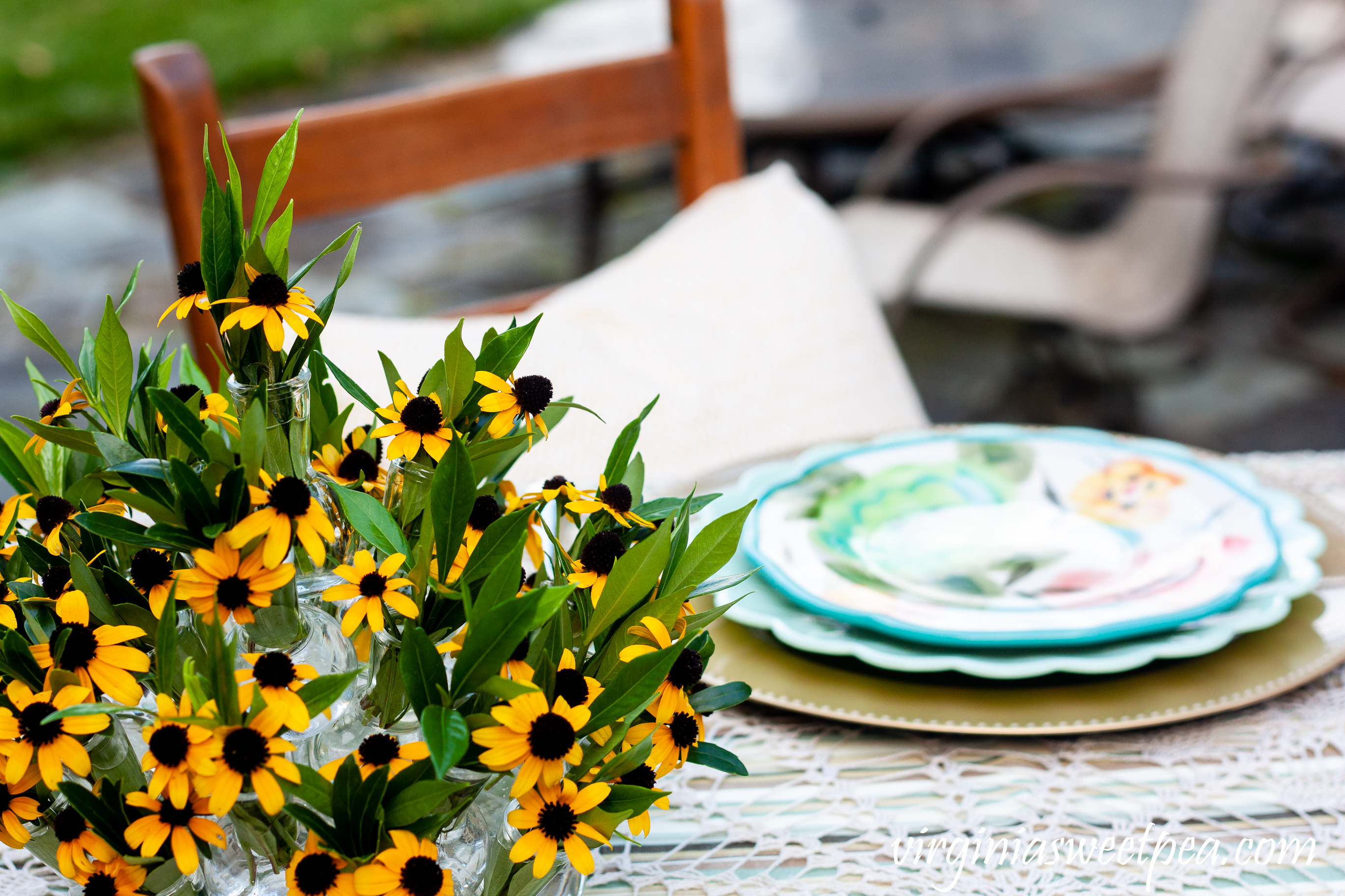 Summer table centerpiece with Rudbeckia and Gardenia foliage