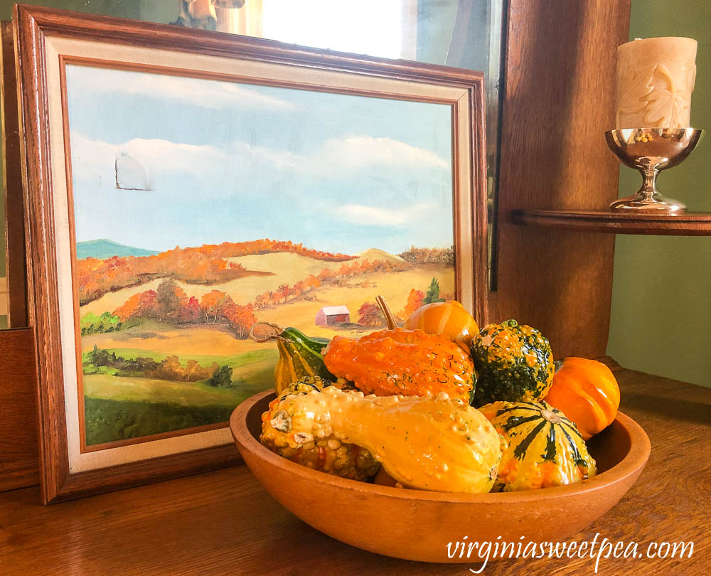 Vermont painting with a wooden bowl filled with gourds