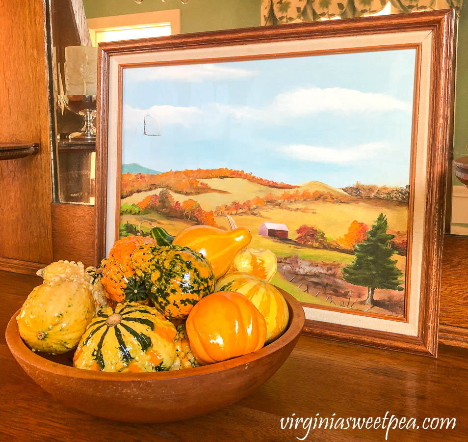 Vermont painting with a wooden bowl filled with gourds