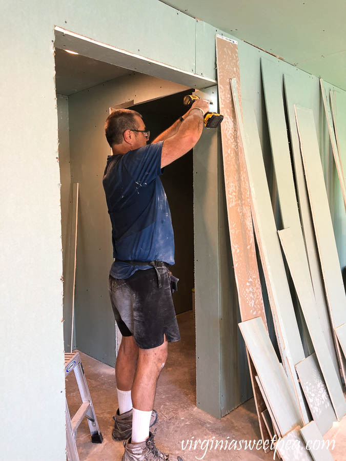 Installing drywall in a basement at Smith Mountain Lake