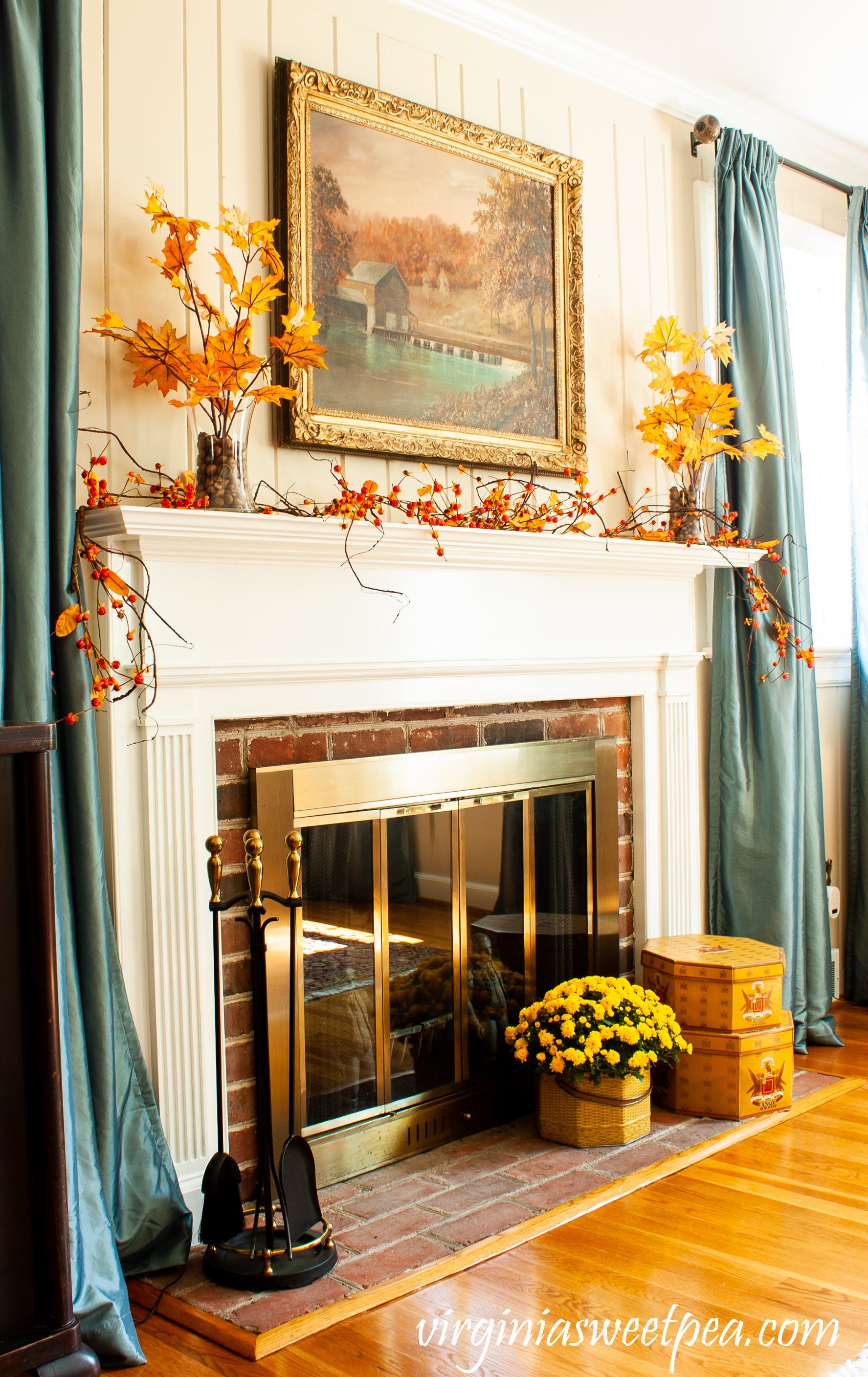 Traditional Fall Mantel - A mantel decorated with a painting of a mill in Sussex County, NJ along with fall foliage, bittersweet, and mums.