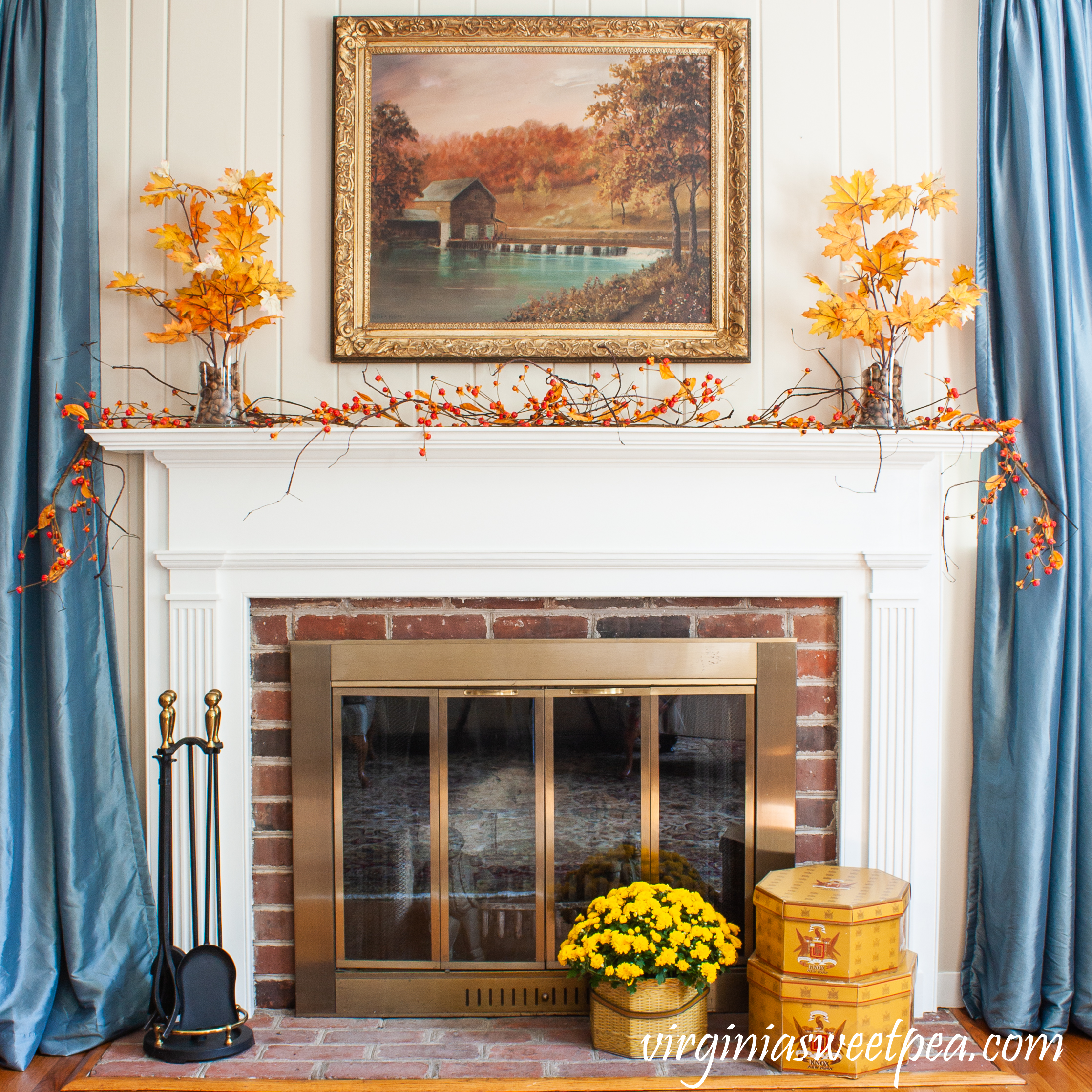 Traditional Fall Mantel - A mantel is decorated for fall with fall foliage, bittersweet, and mums. 