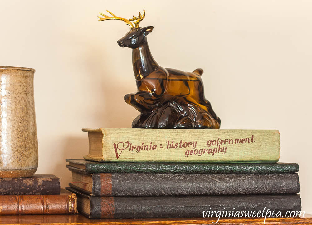 Avon Ten-Point buck Wild Country After Shave Bottle, a 1964 Virginia History Textbook, and yearbooks from Roanoke College in the late 1920's.