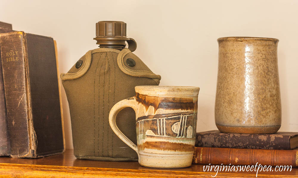 1980's Canteen from Army and Navy, Pitts pottery mug,1896 copy of School Algebra, and a 1928 edition of Irving's The Alhambra