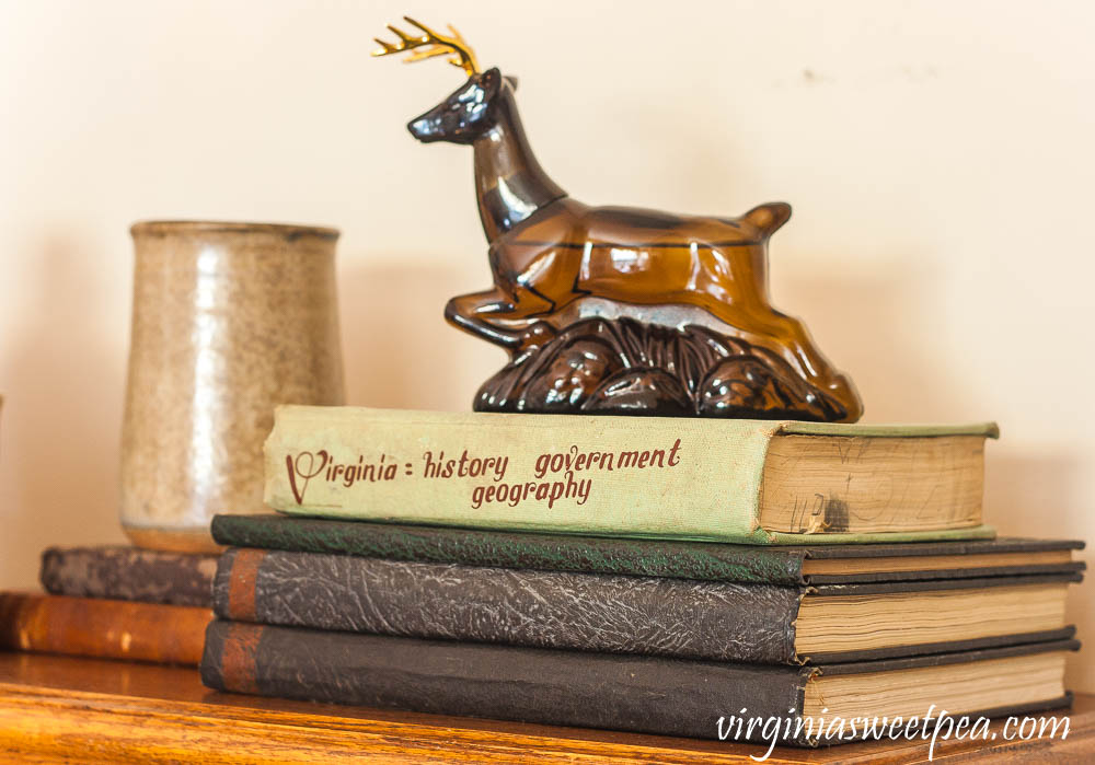 Avon Ten-Point buck Wild Country After Shave Bottle, a 1964 Virginia History Textbook, and yearbooks from Roanoke College in the late 1920's.