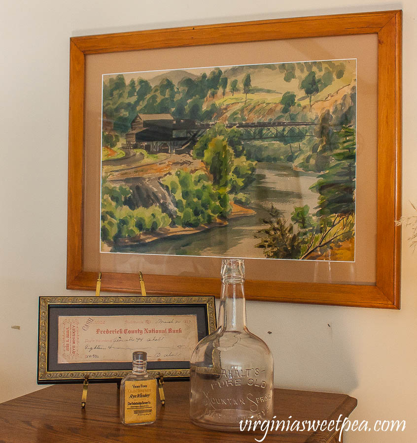 Emlyn Edwards painting with Ahalt distillery in Middletown, Maryland whiskey bottle and bank receipt.