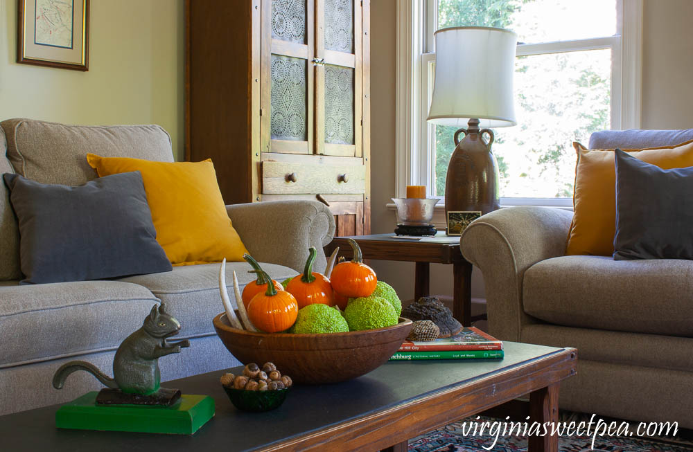 Coffee table decorated for fall with vintage.