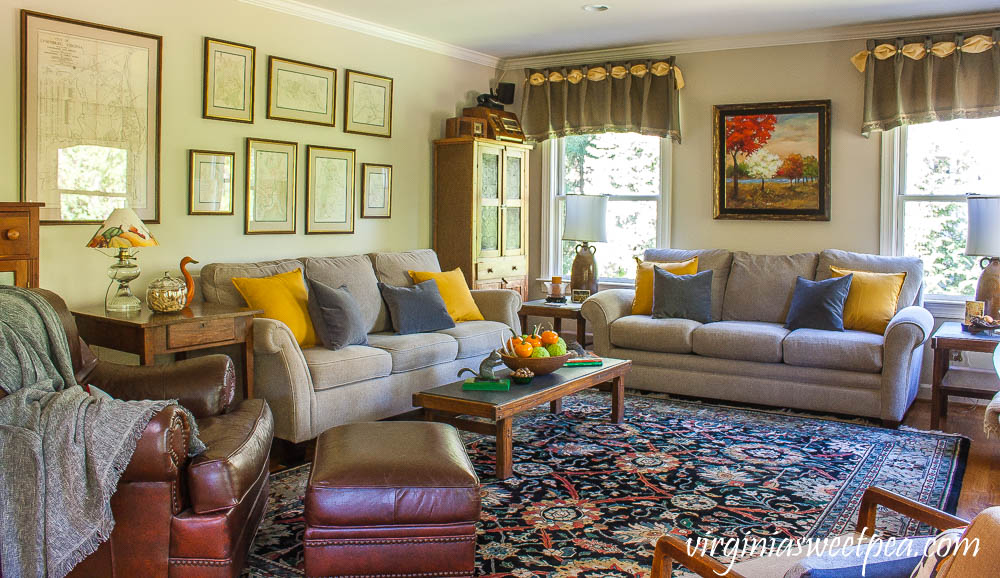 A traditional southern family room is decorated for fall with vintage.