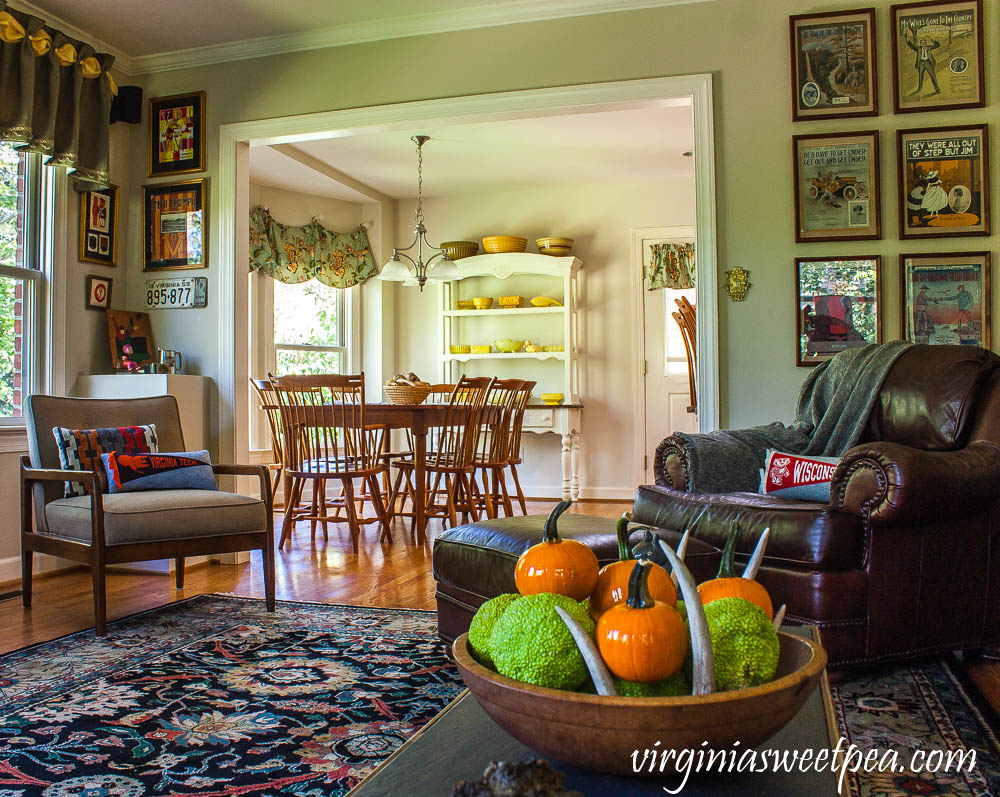 A traditional southern family room is decorated for fall with vintage.