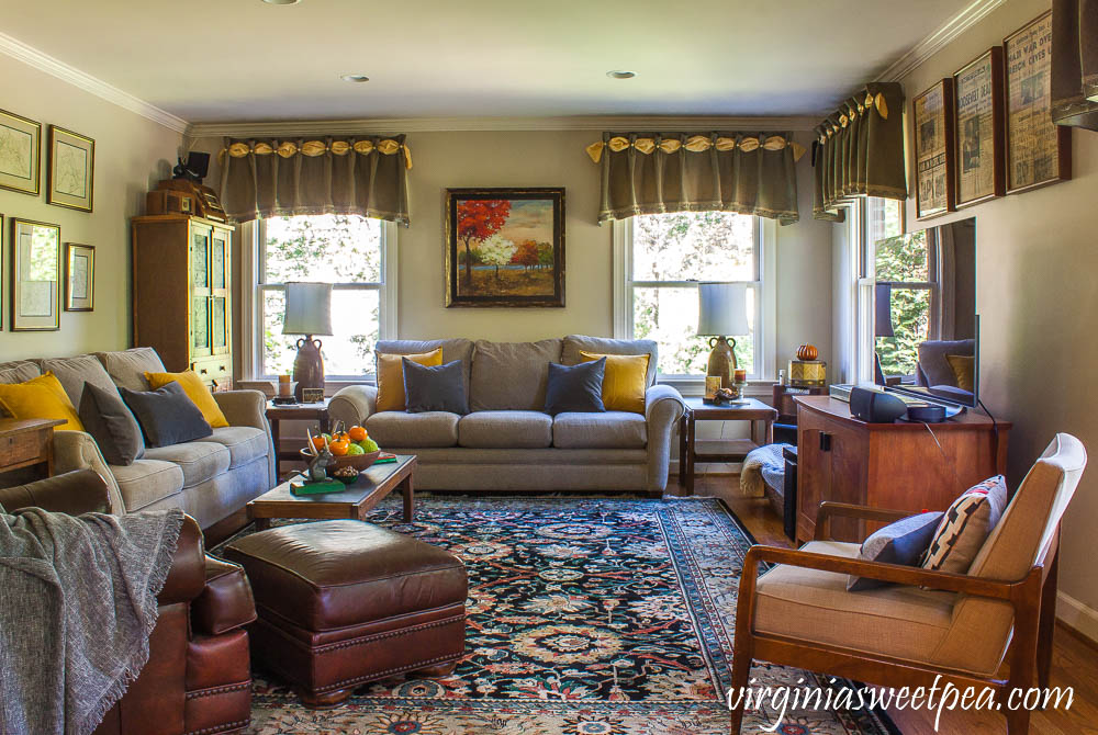 A traditional southern family room is decorated for fall with vintage.