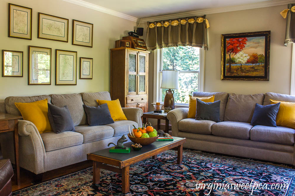 A traditional southern family room is decorated for fall with vintage.