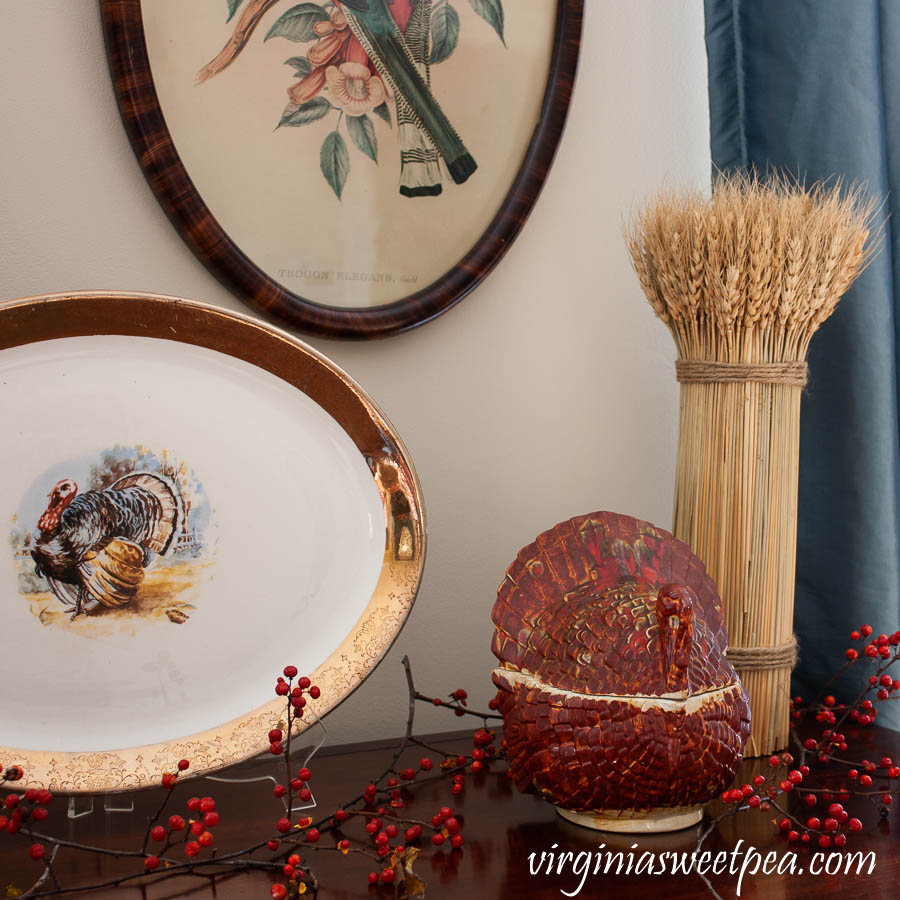 Thanksgiving vignette with a vintage turkey platter and candy dish , a wheat sheaf, and Bittersweet.
