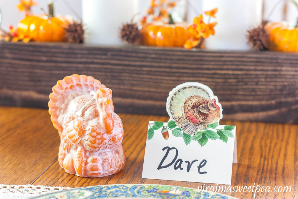 Thanksgiving place setting with a Caspari turkey place card and a beeswax turkey from the Beeswax Candle Company in Lynchburg, VA